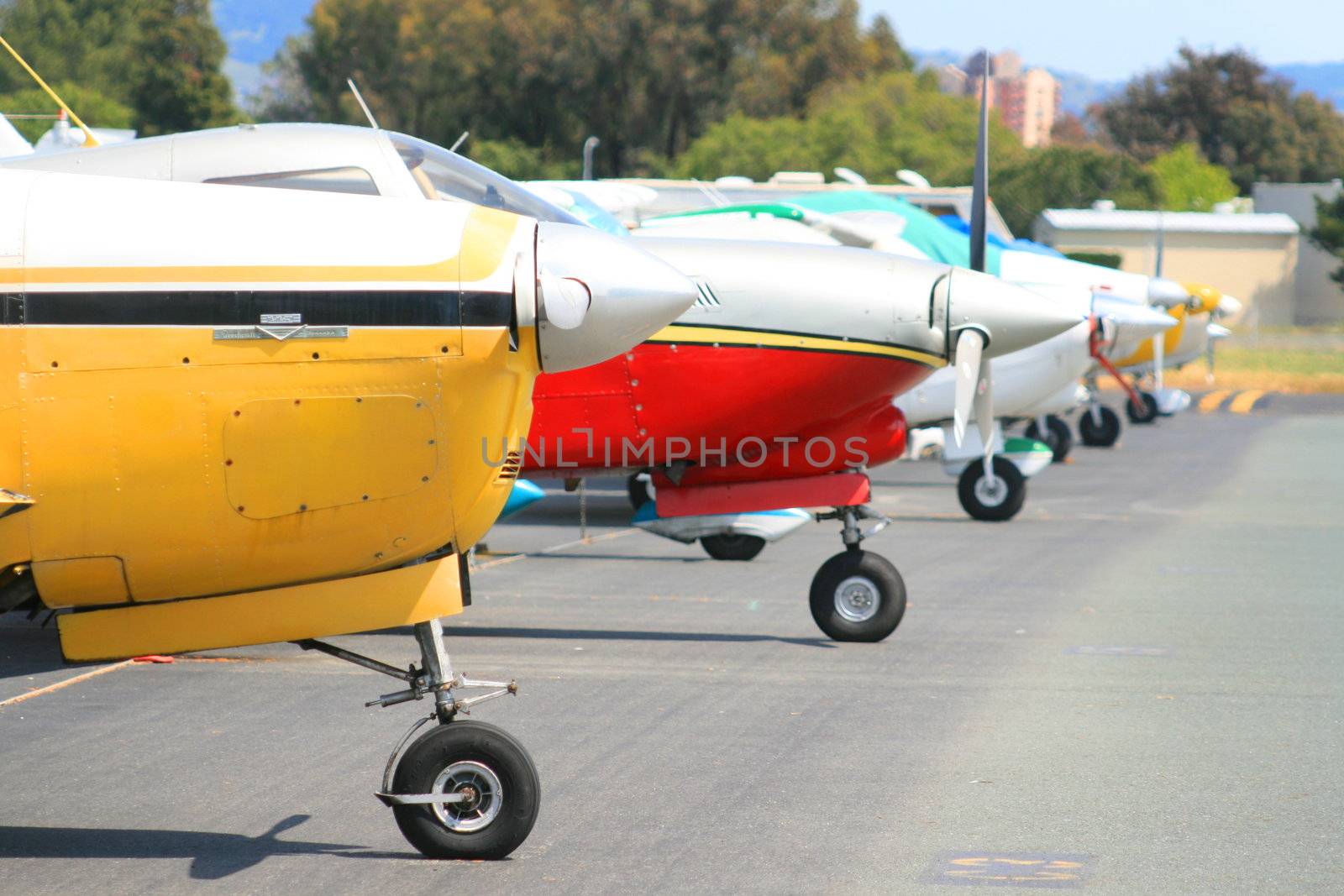 Close up of a row of airplanes.
