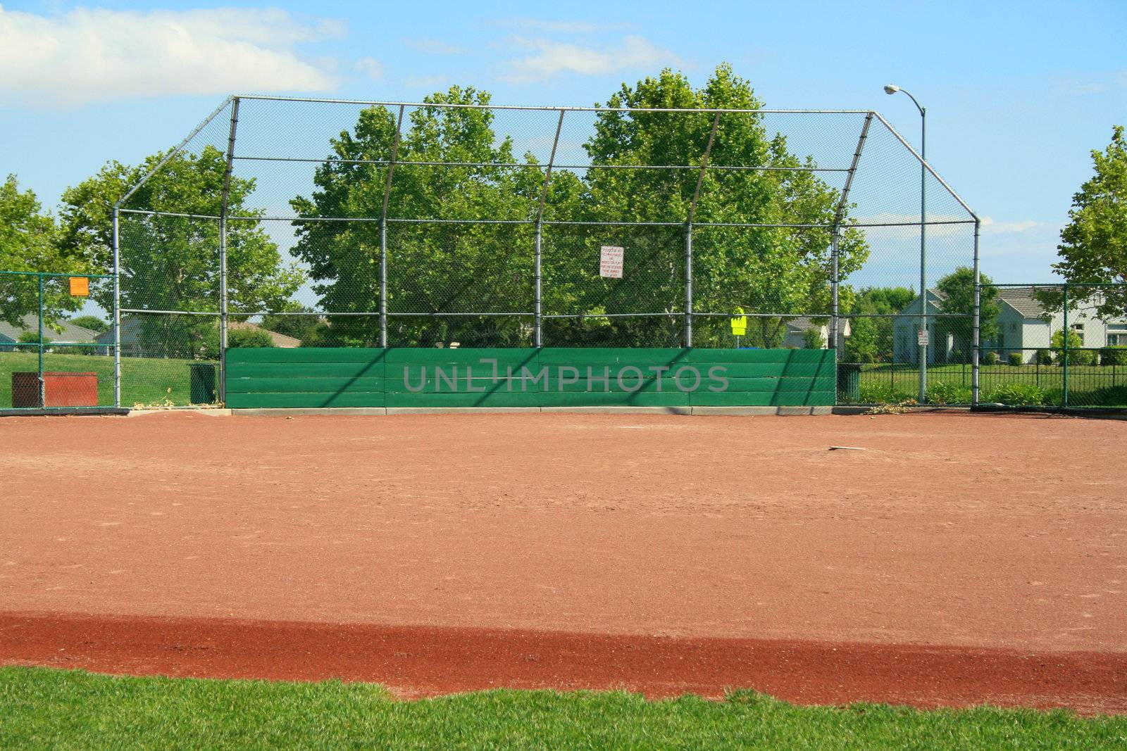 Empty baseball field on a sunny day.
