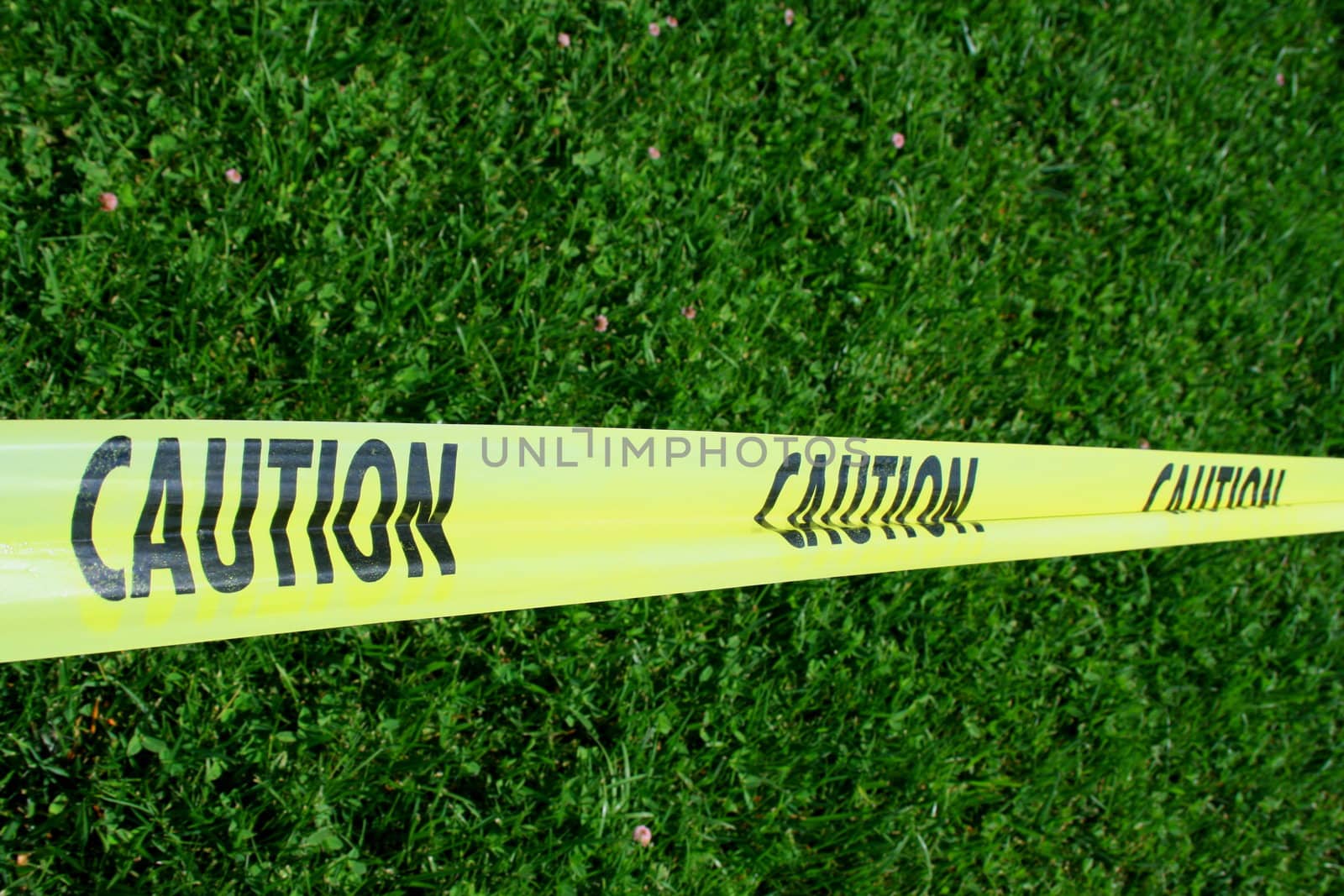 Close up of a yellow caution tape.
