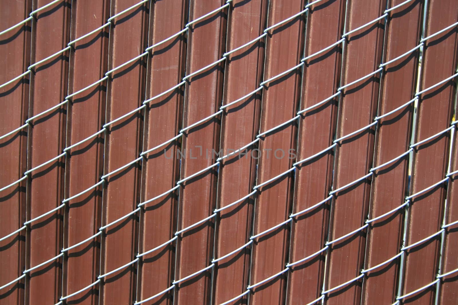Close up of a chain link fence showing unique pattern.
