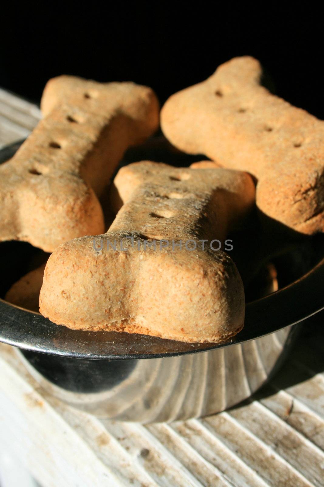 Close up of the dog cookies in a bowl.
