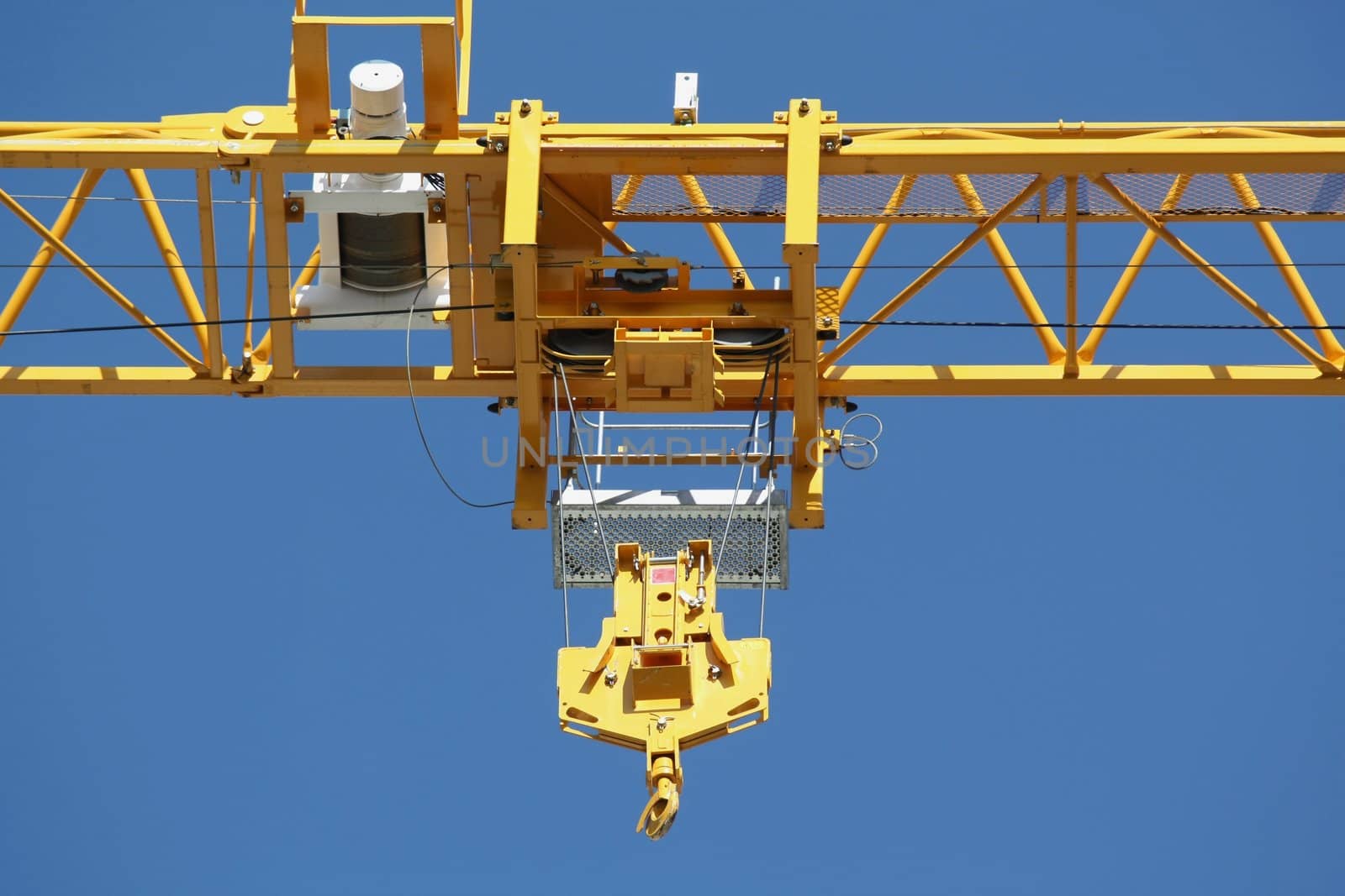 Pulley on a crane on a blue sky background