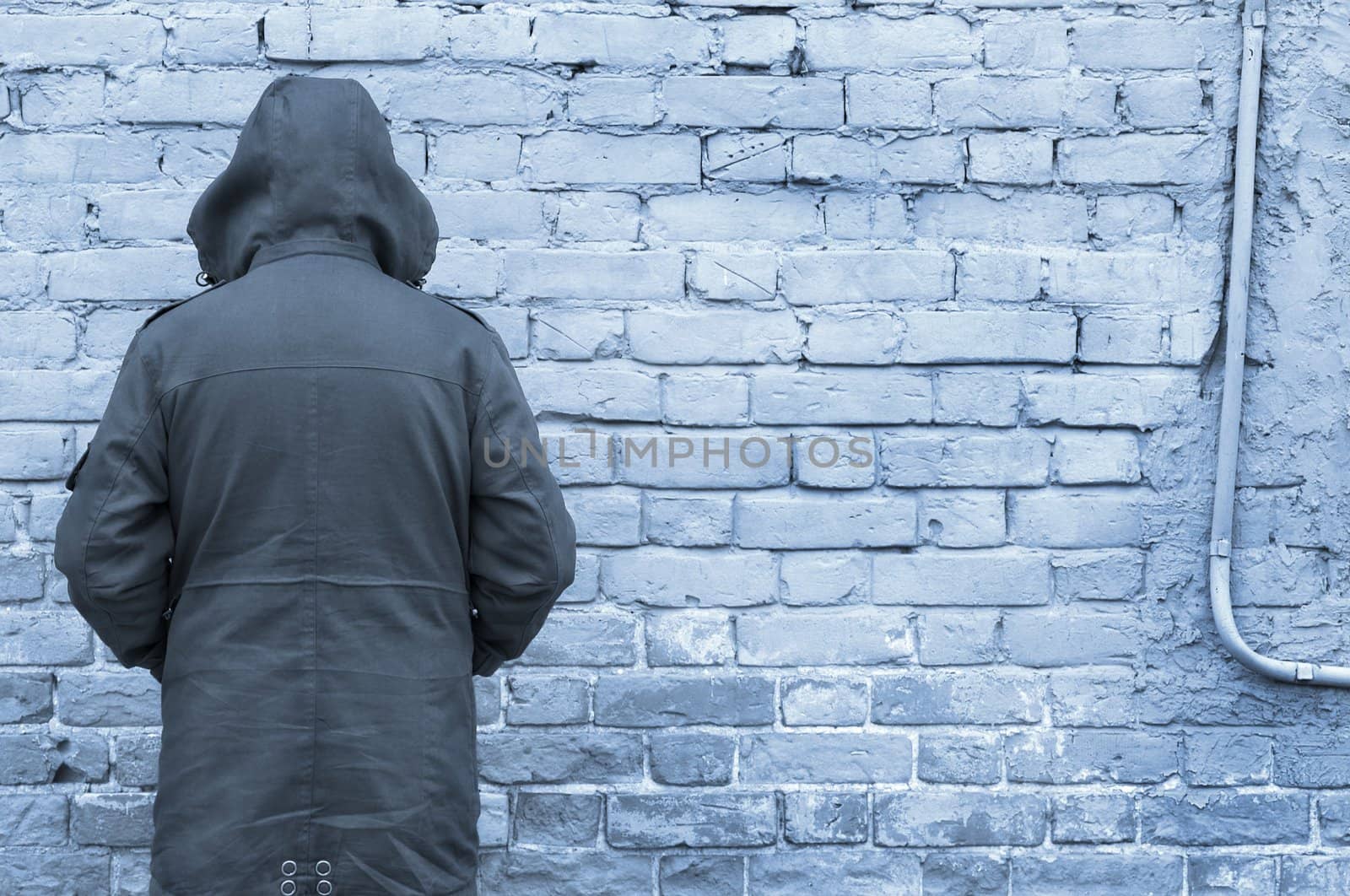 man against wall