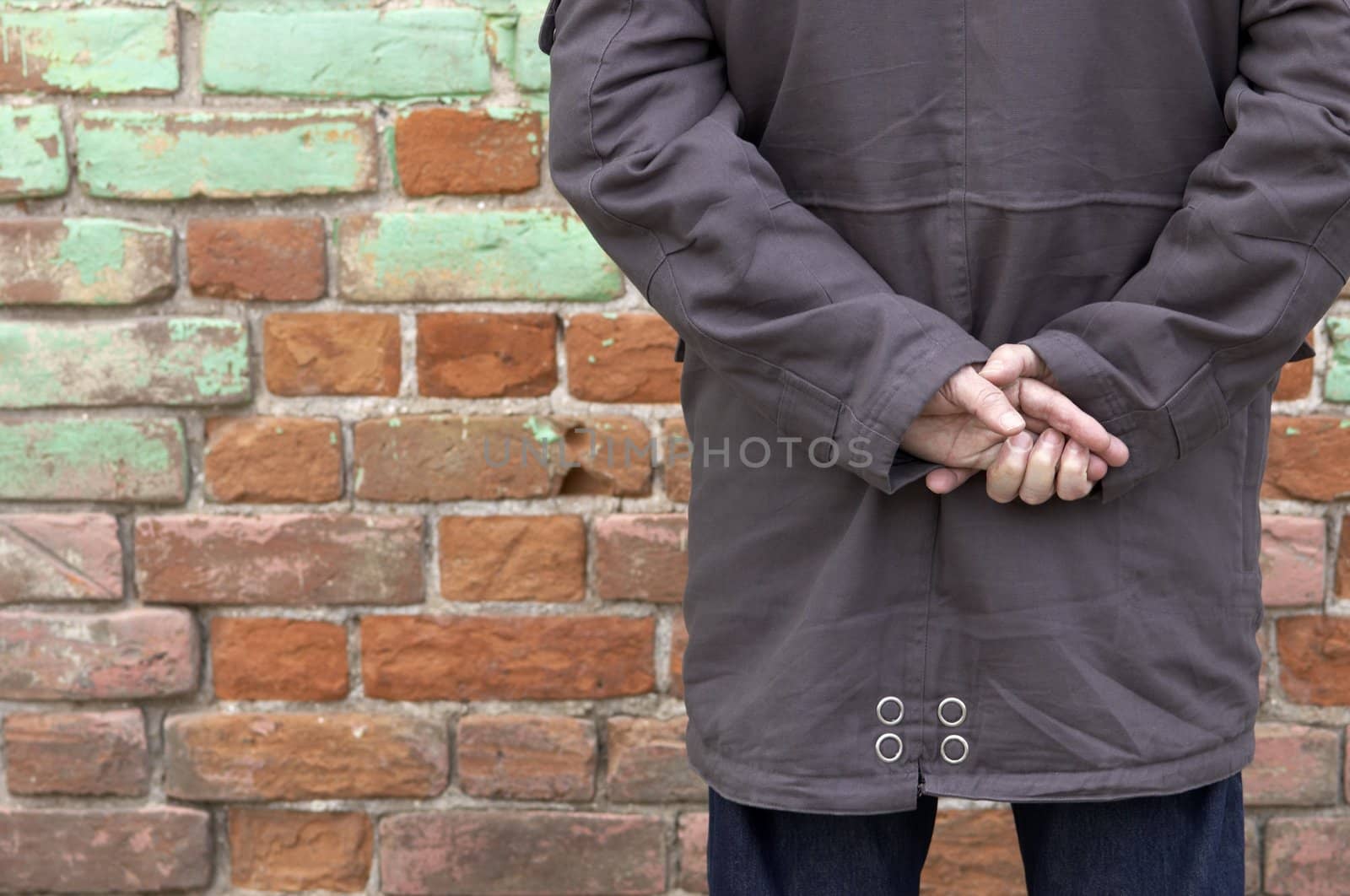 man against wall