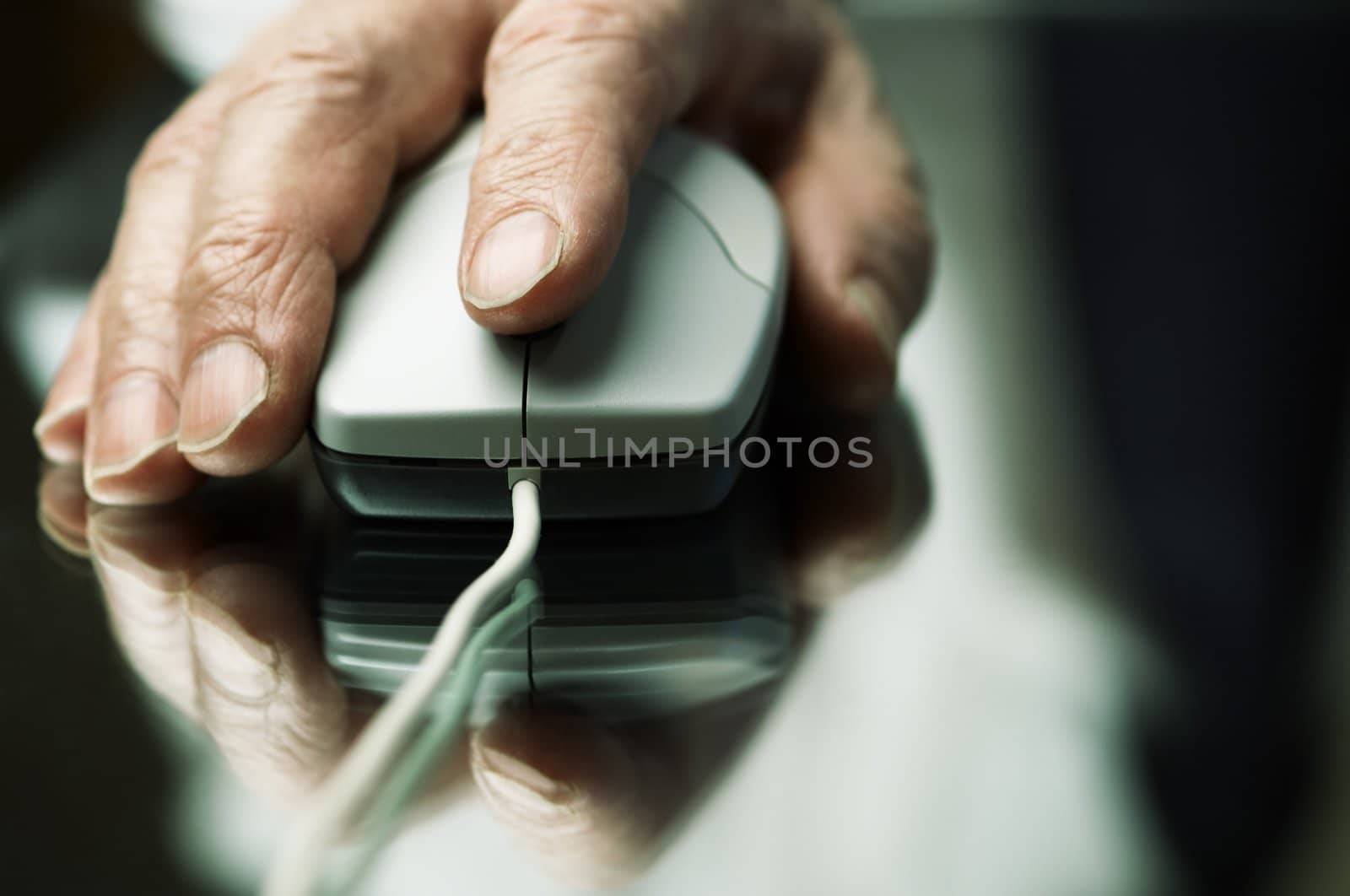 hand of the man with computer mouse,focus point on the finger,special tone photo f/x