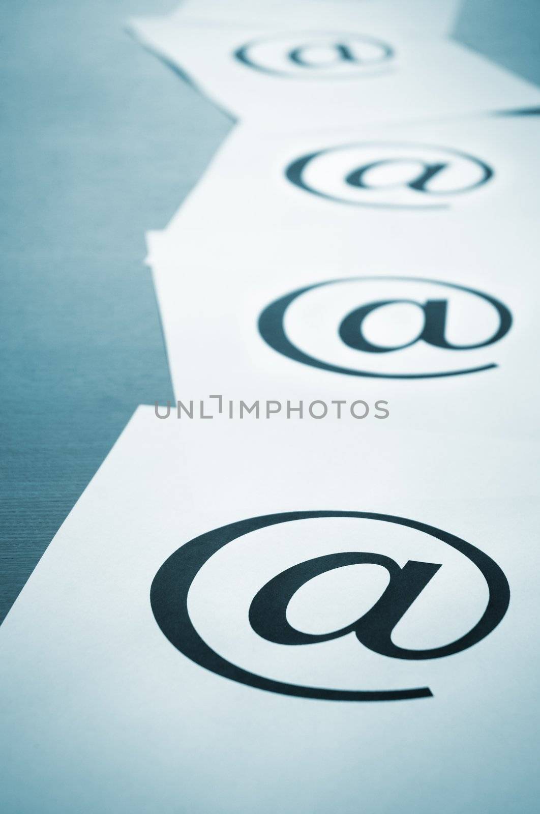special blue tone with dark vignetting,focus point on the center of upper part of the nearest e-mail symbol