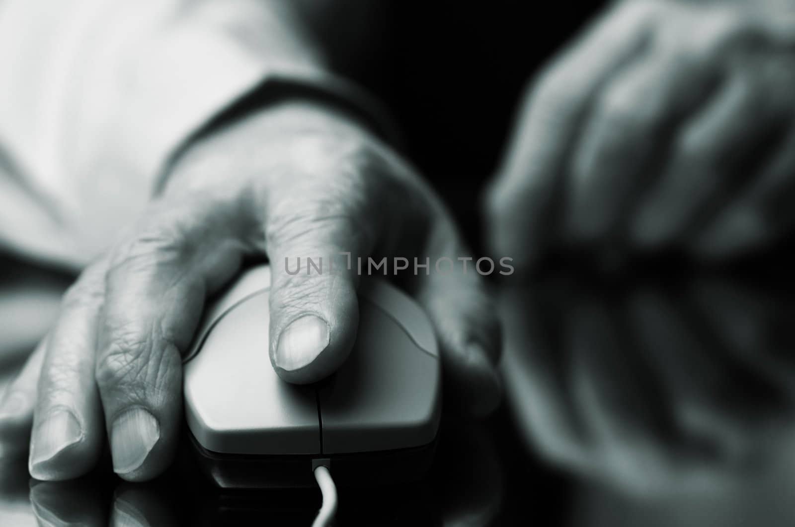 hand of the man with computer mouse,focus point on the finger,special tone photo f/x
