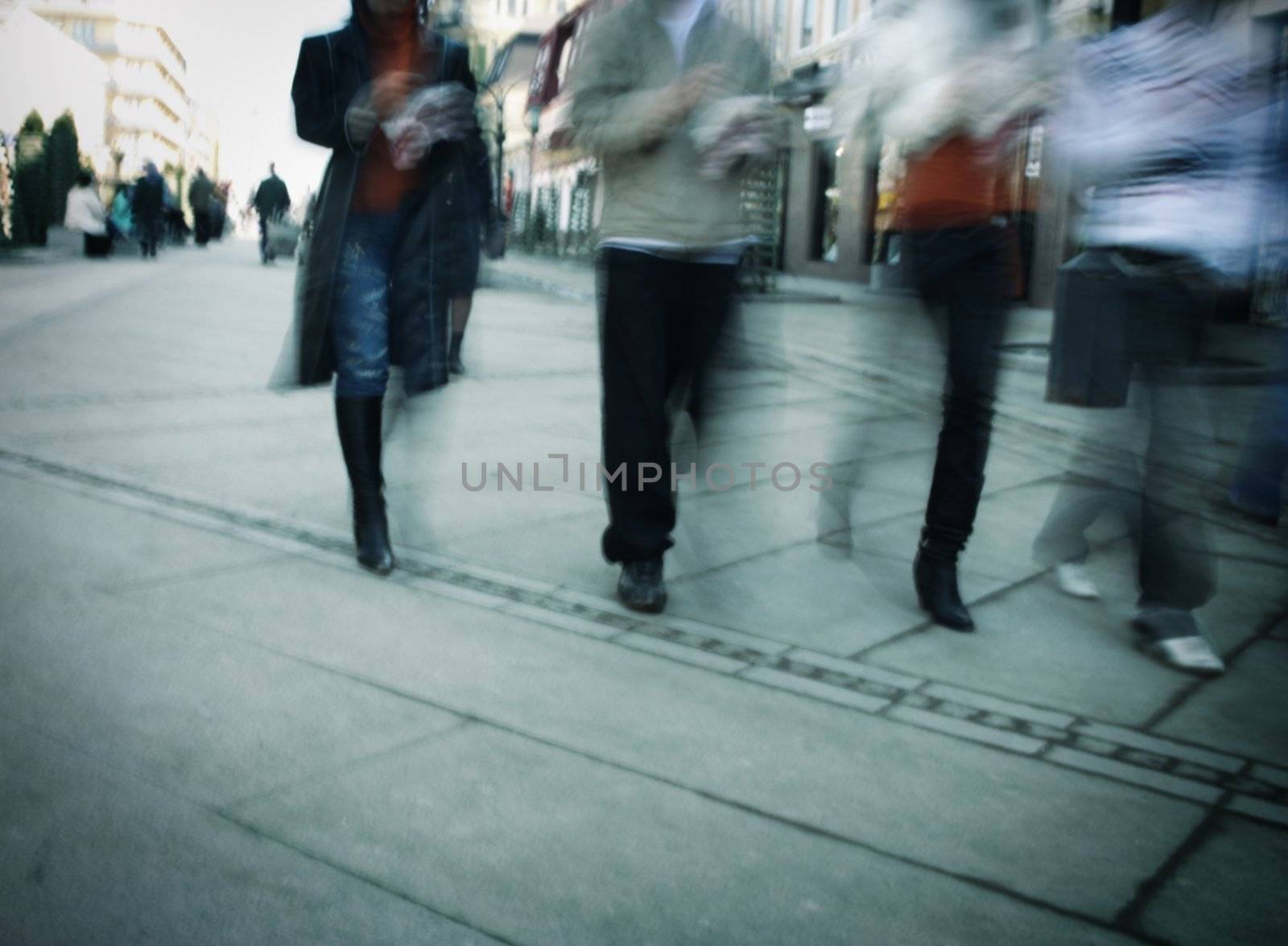 people walking, special blur zoom motion and toned wit dark vignetting photo f/x