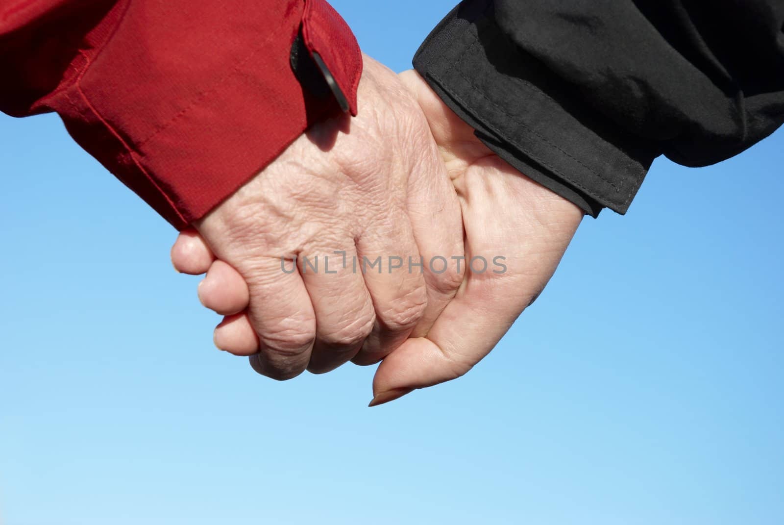 united fingers (connection concept) focus point on center of photo