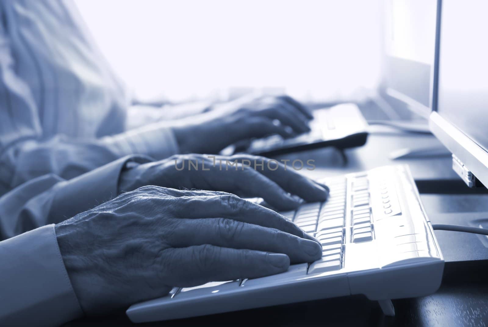 special toned photo f/x, focus point on nearest hand (businessman)