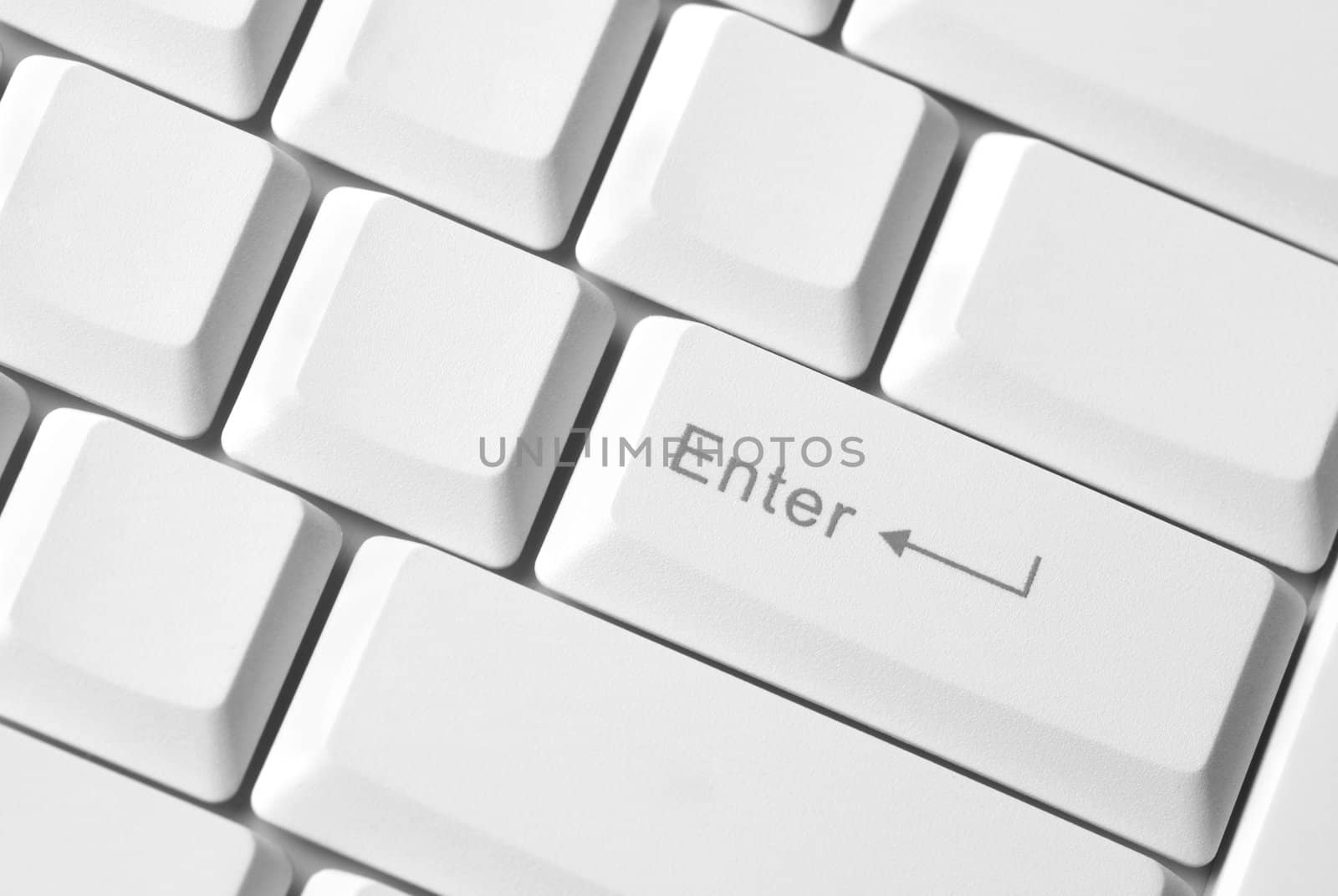 pc concept (part of white computer Keyboard ,focus point on Enter)