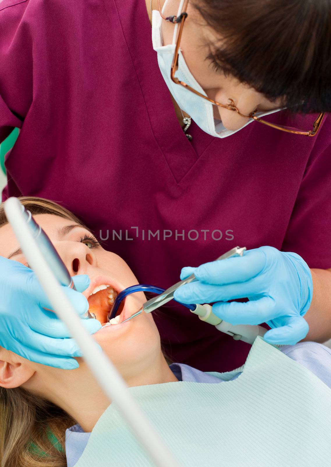 Dentist working patient by vilevi