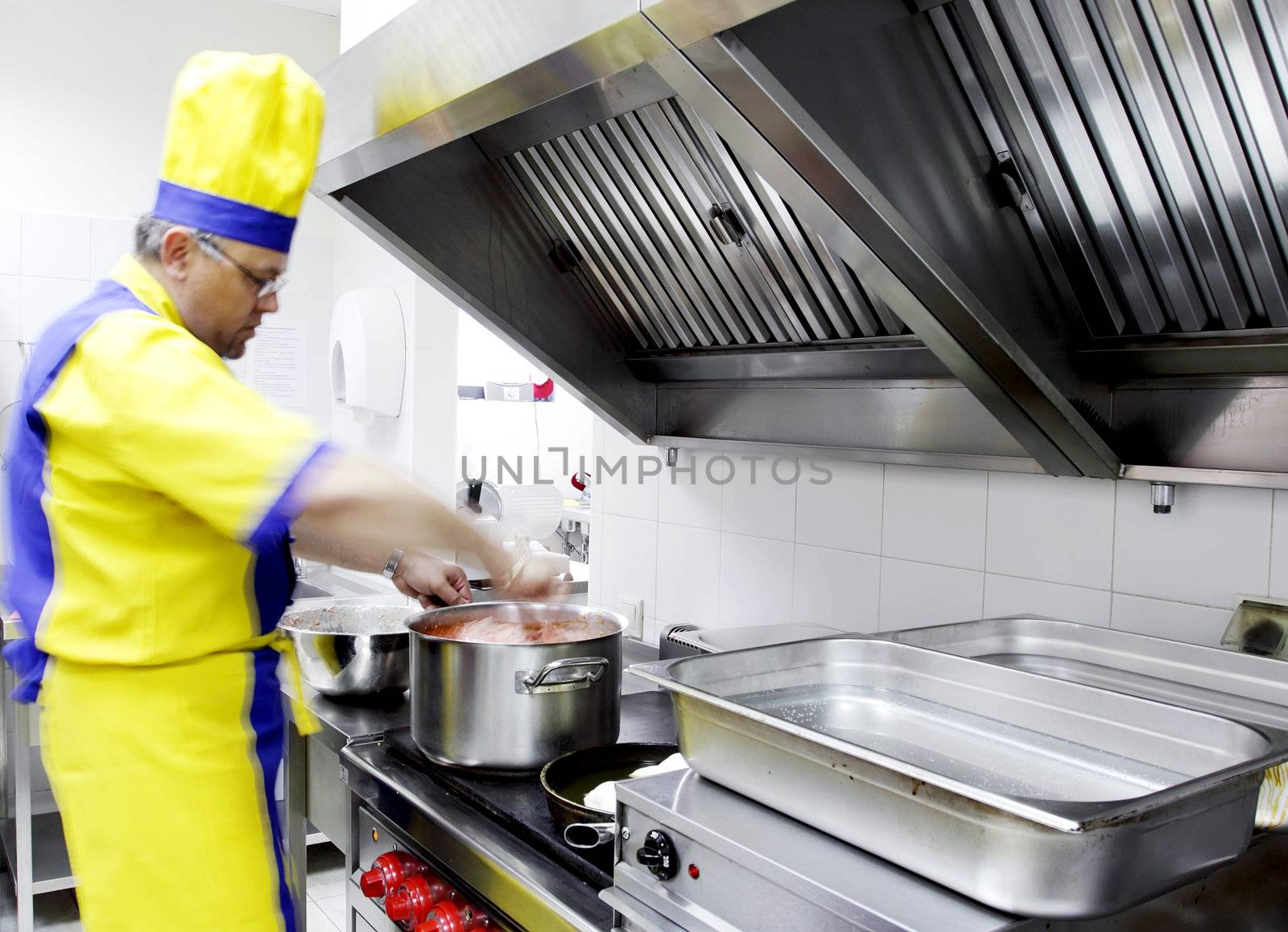 a cook preparing a dish on the stove