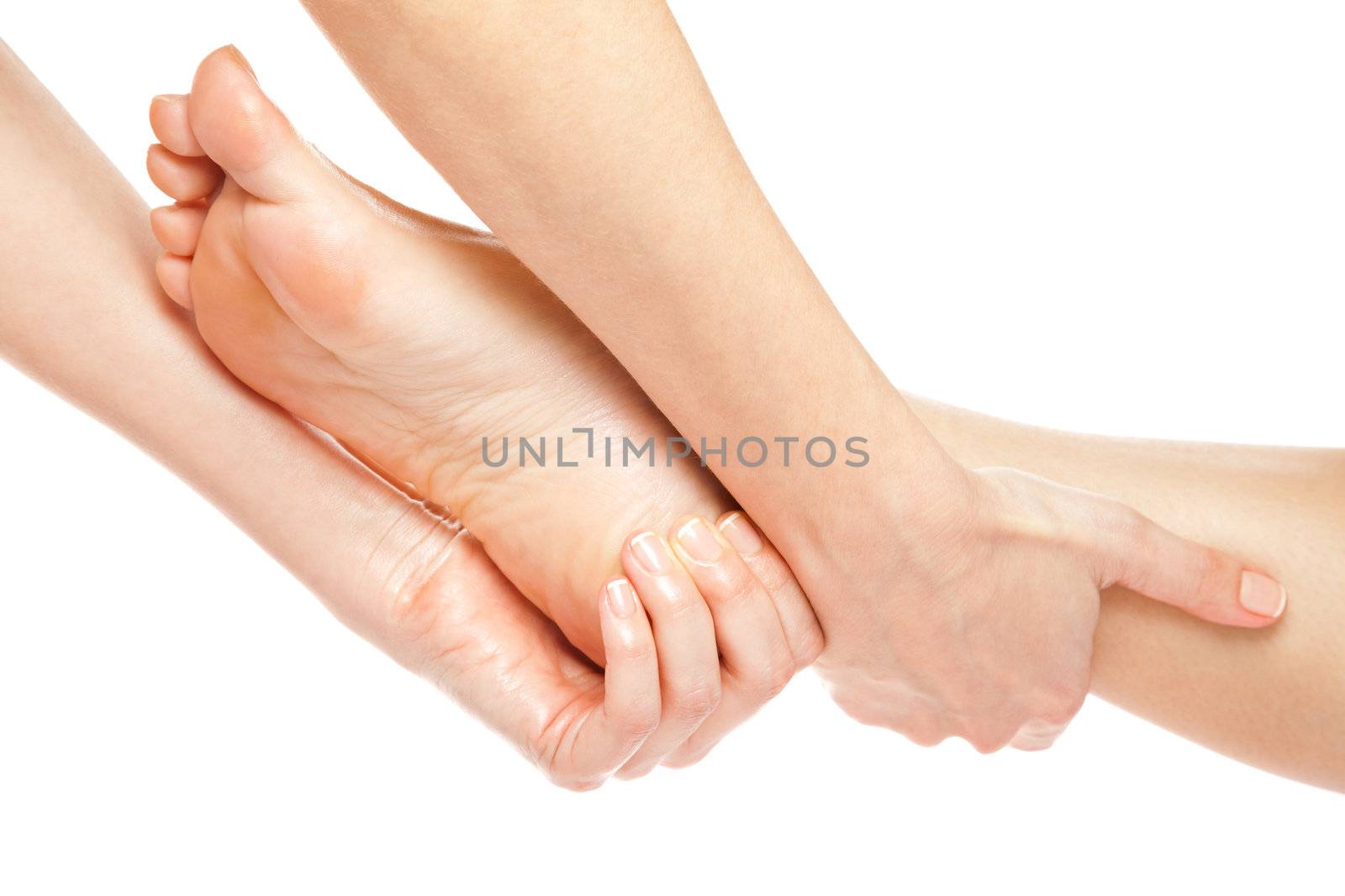 Woman hands giving a gentle foot massage isolated on white