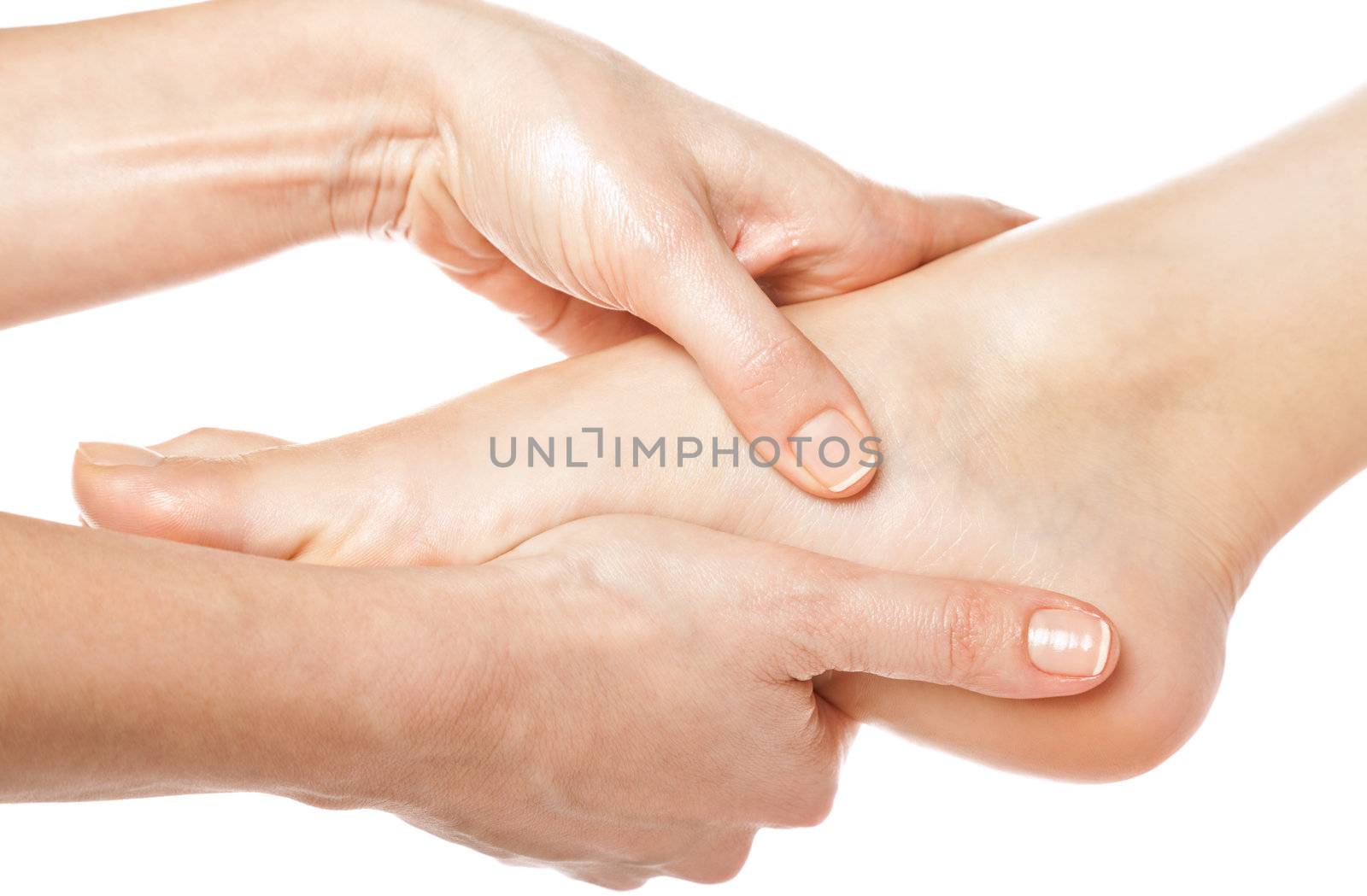 woman hands giving a foot massage on white background