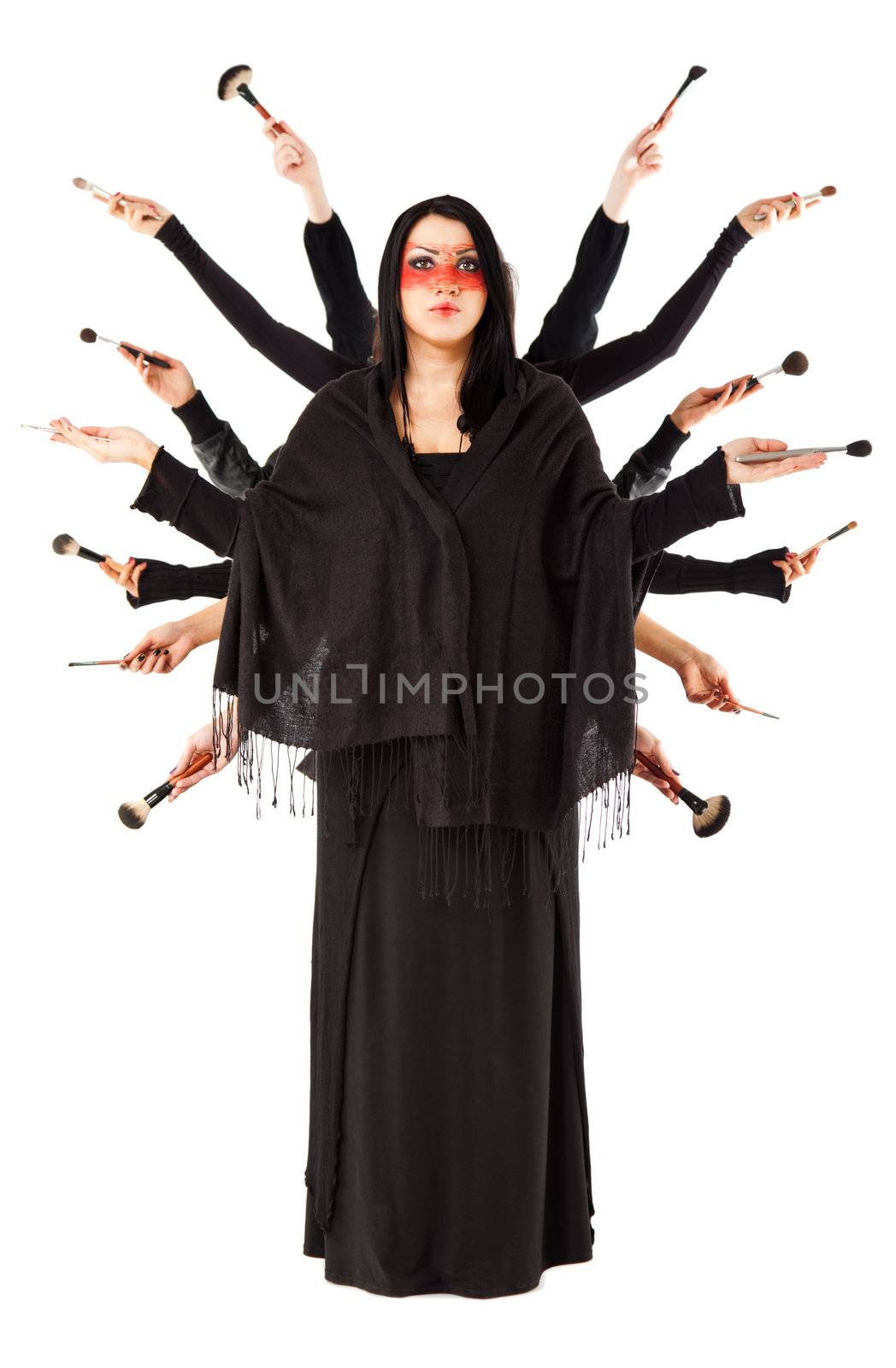 Young artist with fourteen hands holding make-up brushes, interpretating Shiva