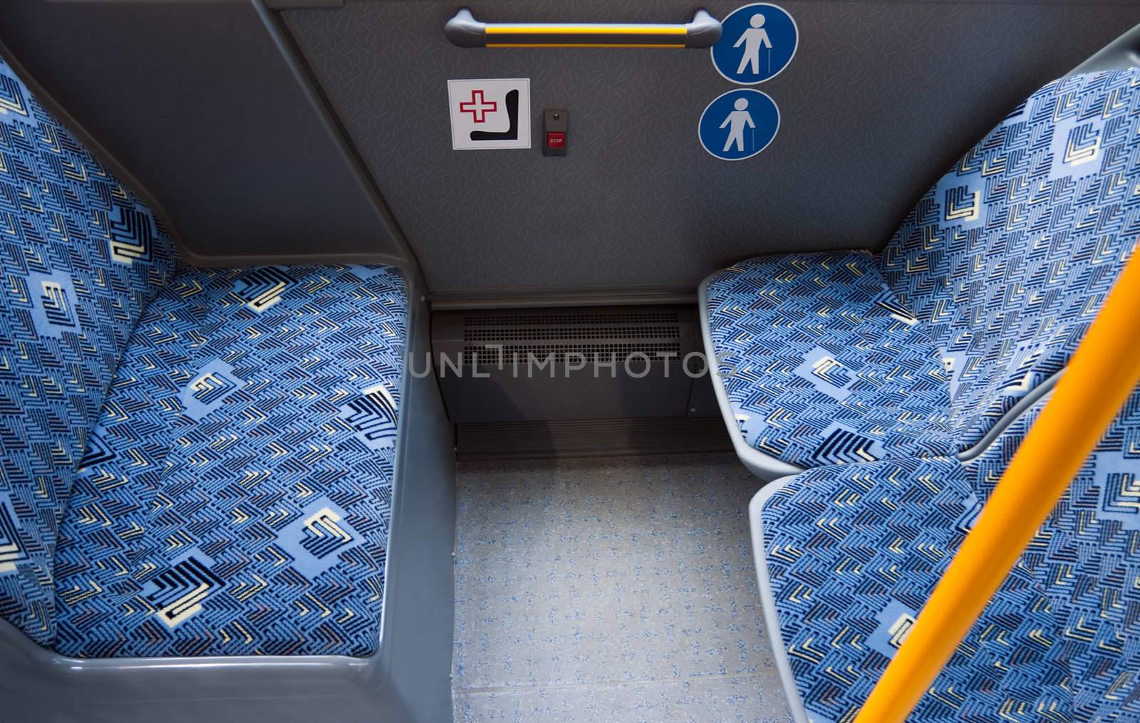 empty seats in a public buss for people with medical issues