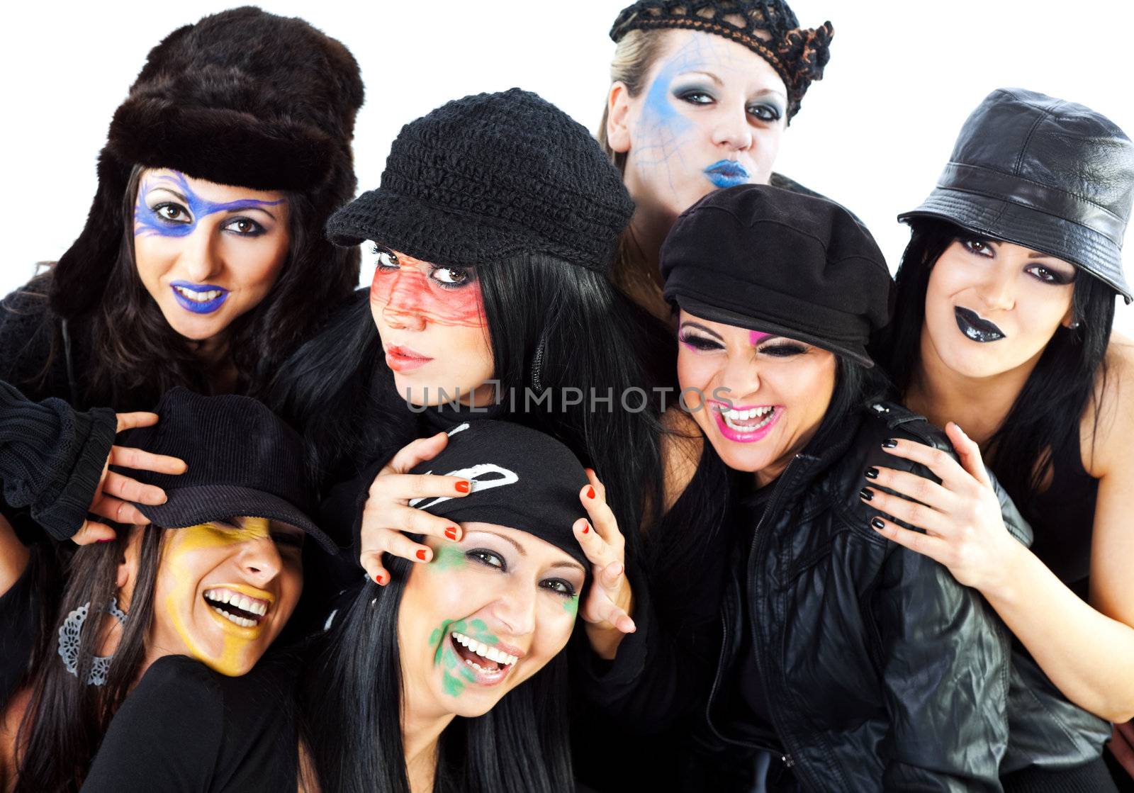 Seven girls prepared for halloween hugging and smiling