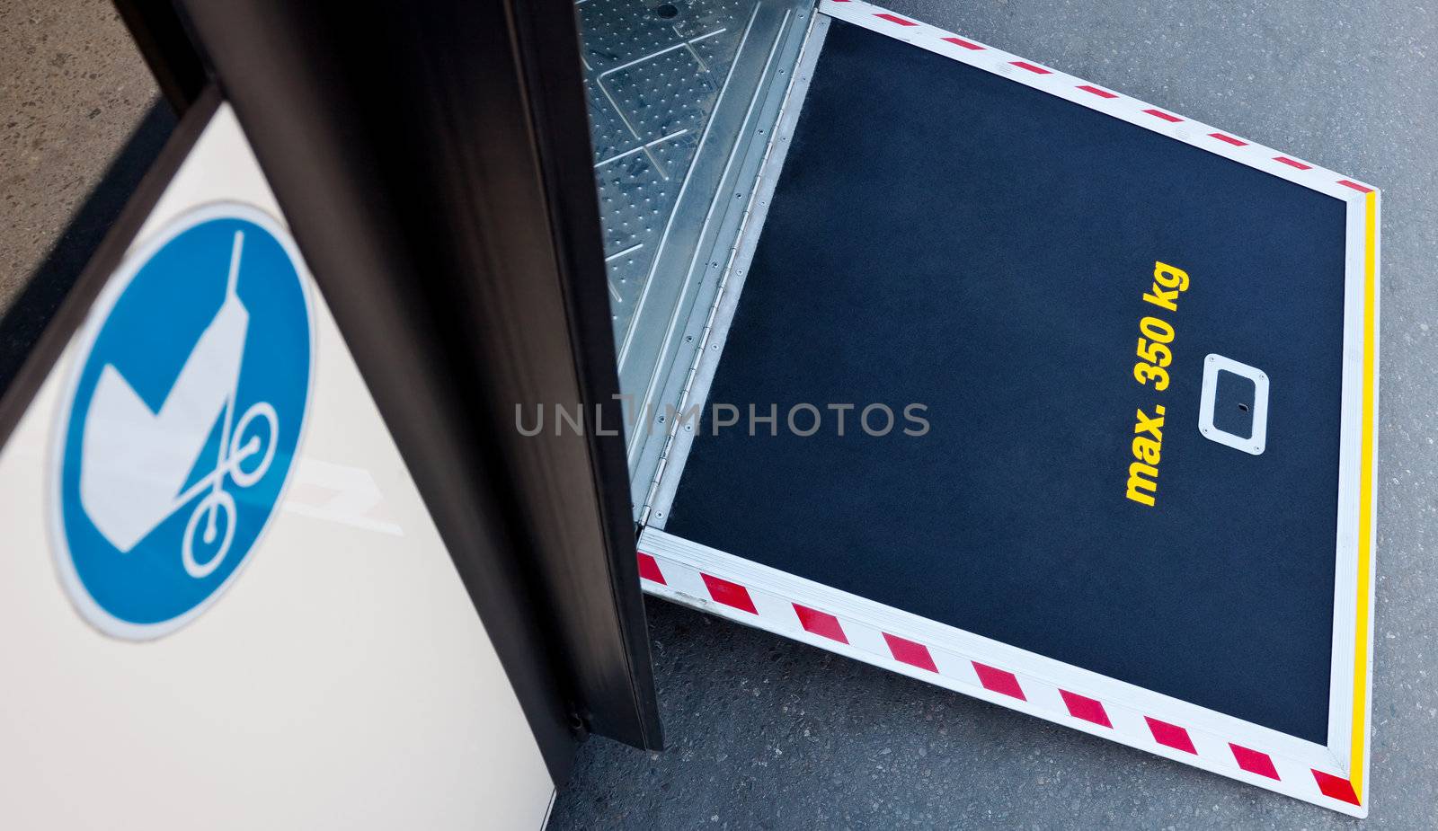 a platform on a bus door with a stroller icon