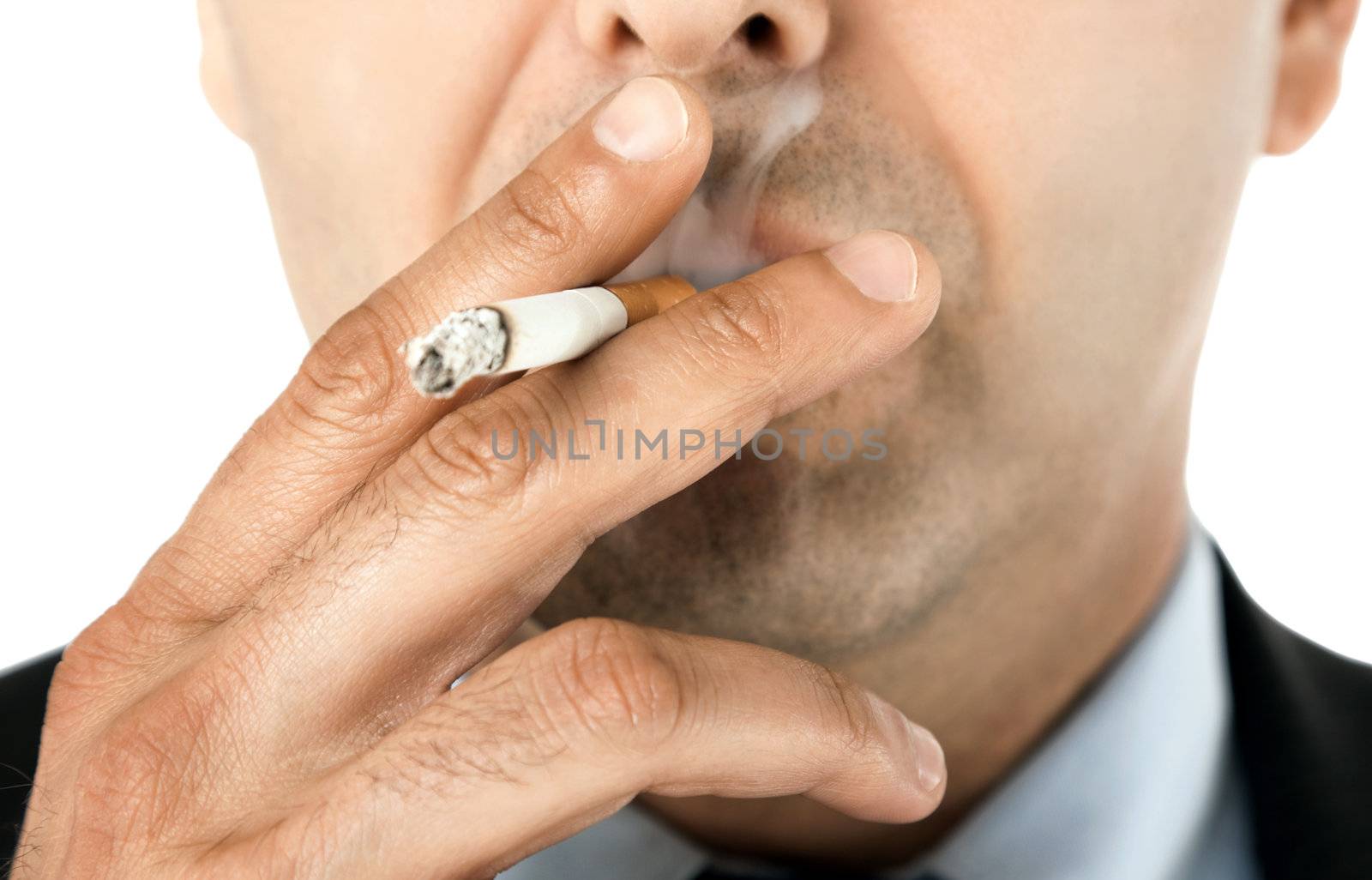 Close-up of man face holding cigarette and smoking