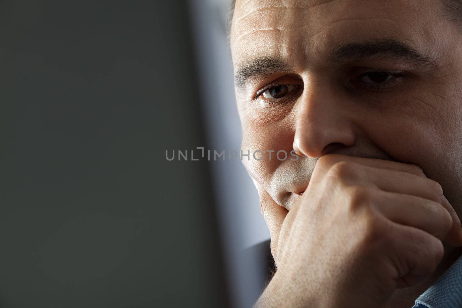 Portrait of man with laptop thinking face and hand