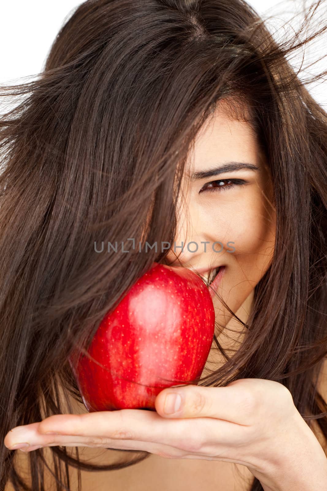 Close-up of a beautiful smiling female holding red apple