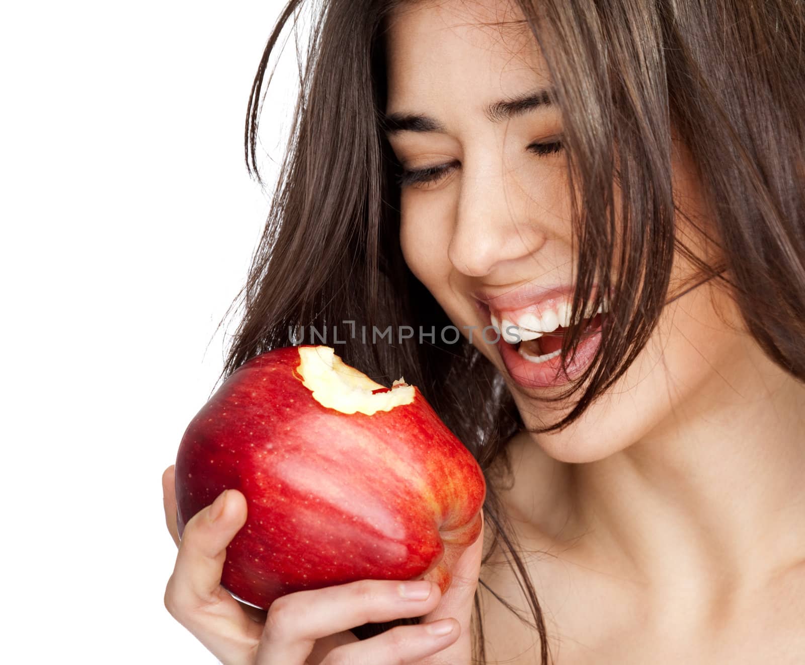 beautiful female smiling and holding a red bitten apple