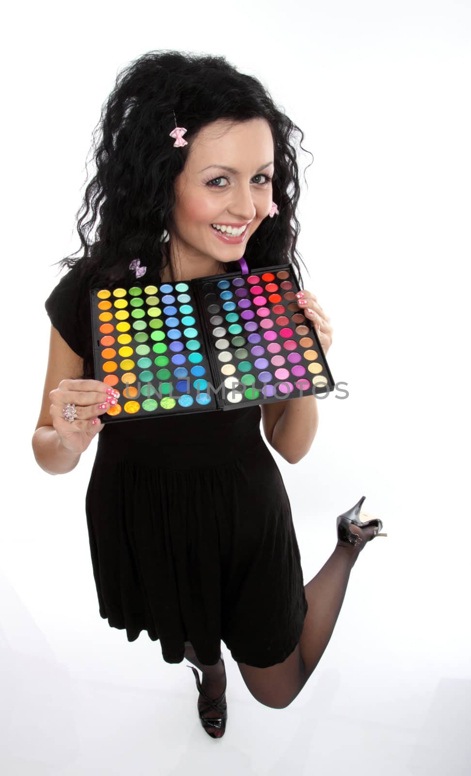 Beautiful lady holding a make-up palette