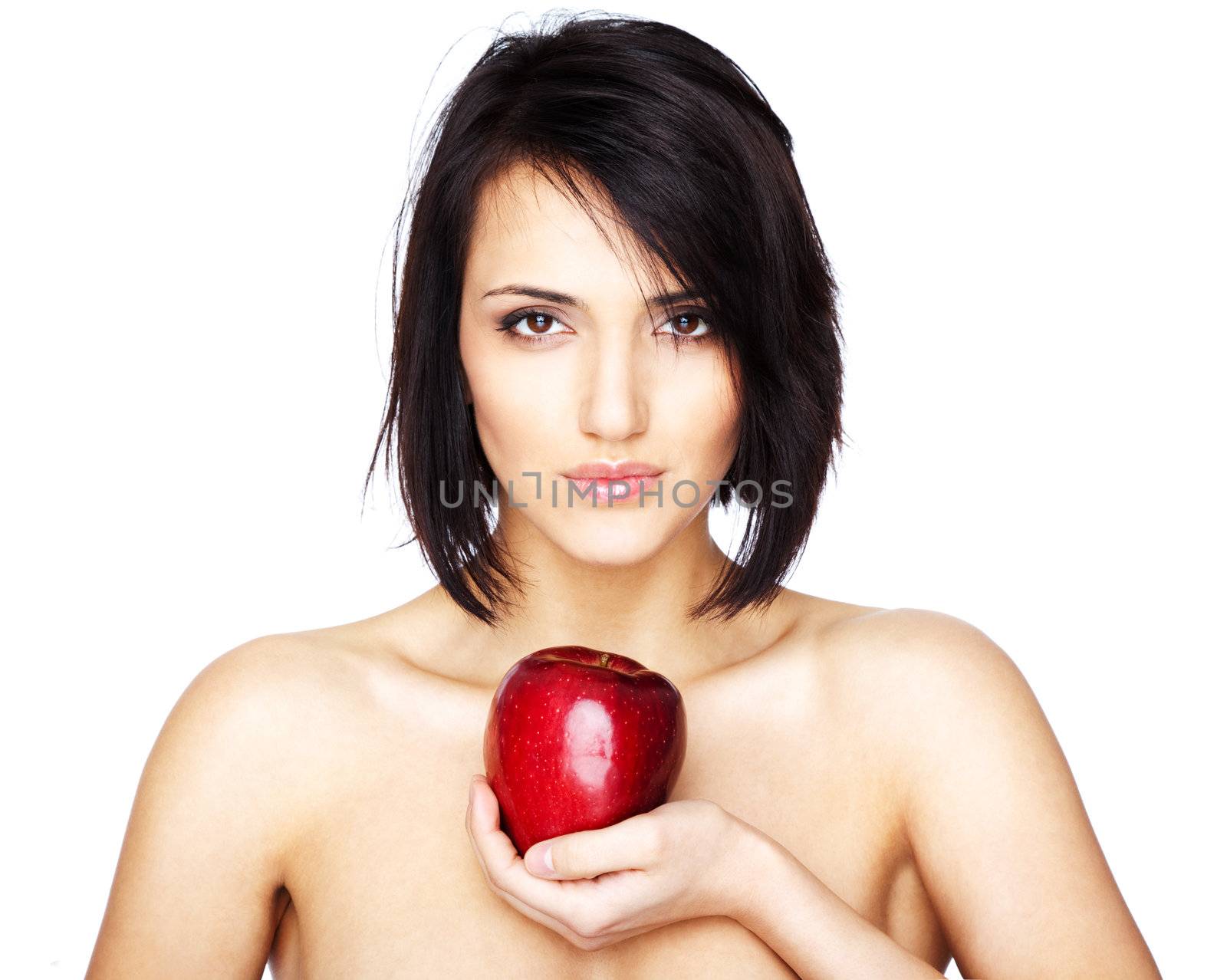 Beautiful naked woman holding an apple isolated on white
