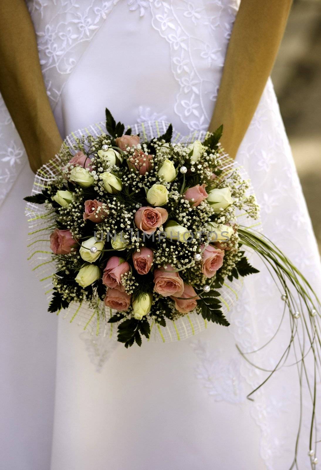 wedding roses in hands,focus point on flowers