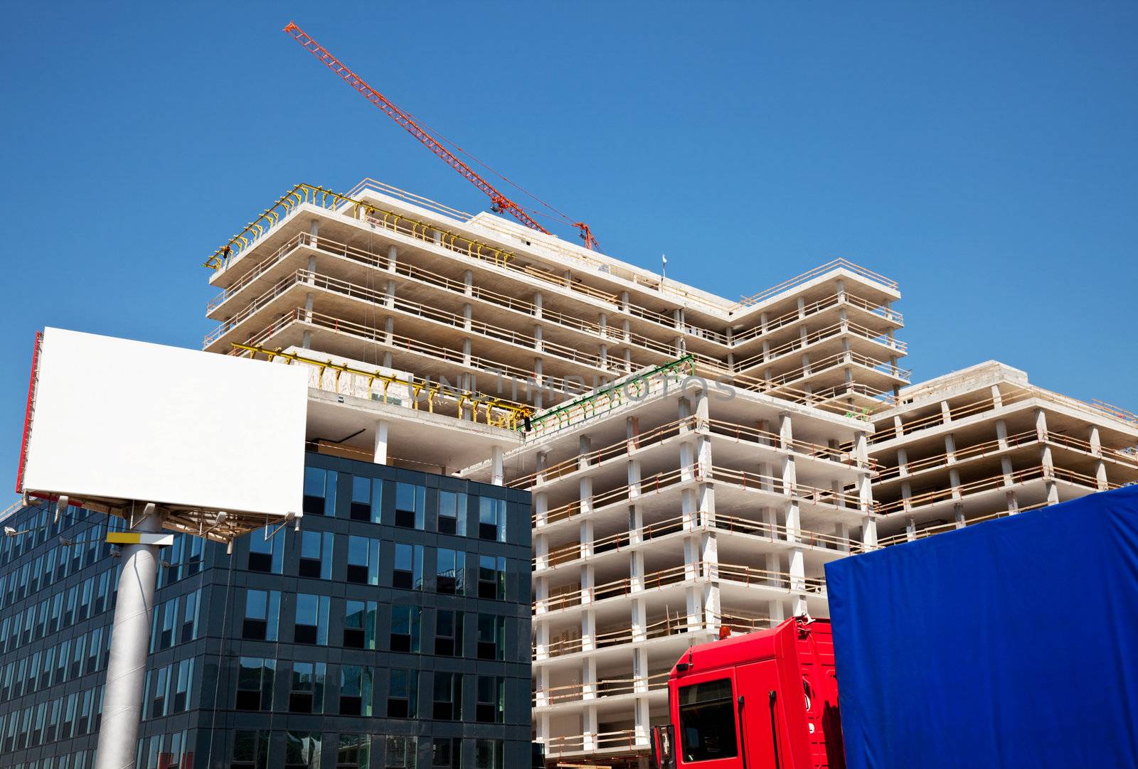 an empty billboard in front of a construction site