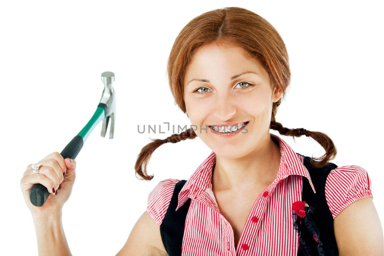 smiling red head with braids and braces holding claw hammer