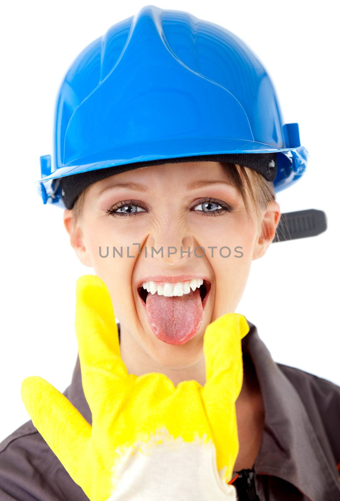 Portrait of young female construction worker with blue hardhat and yellow glove, showing rock on sign