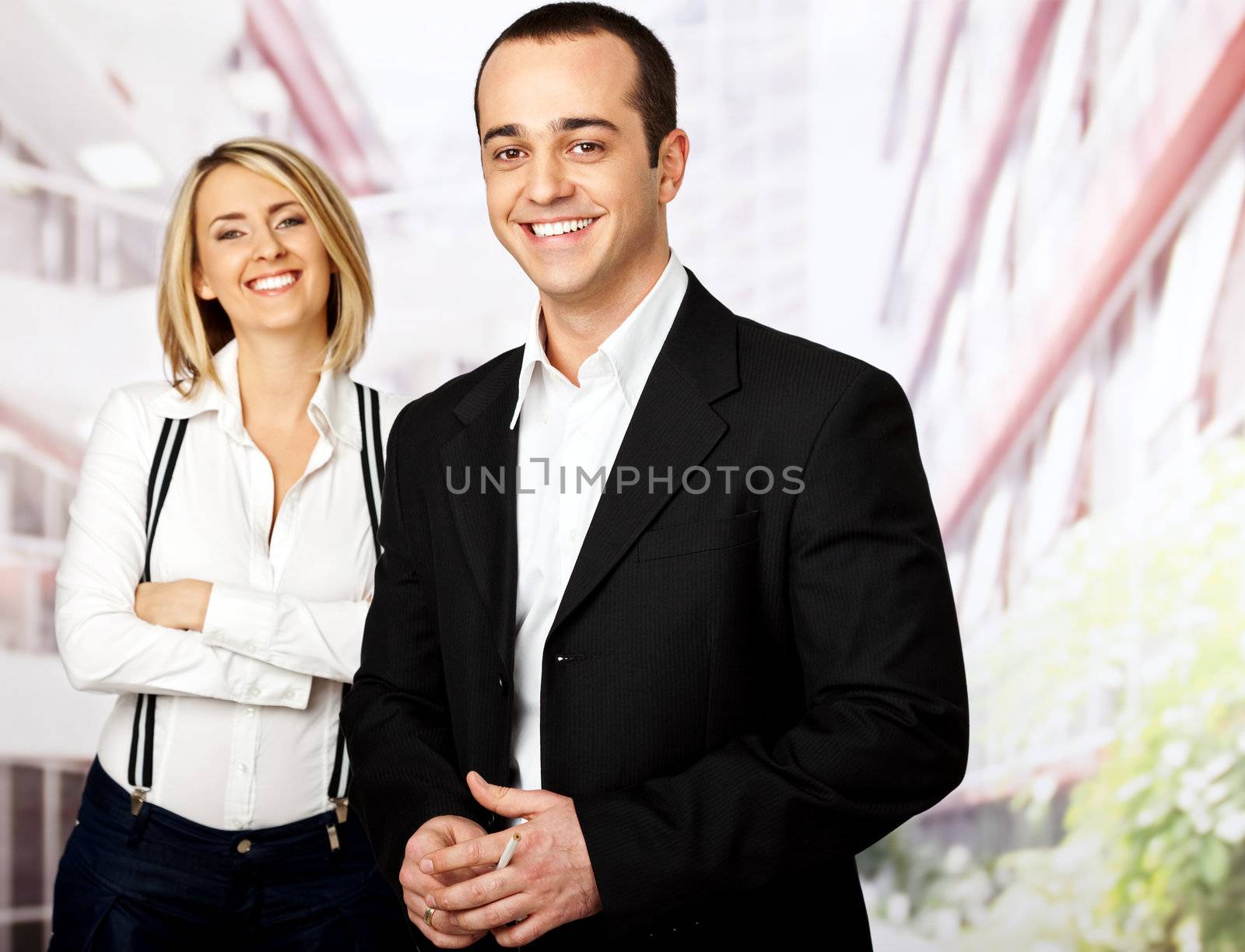 business team of two smiling male on focus