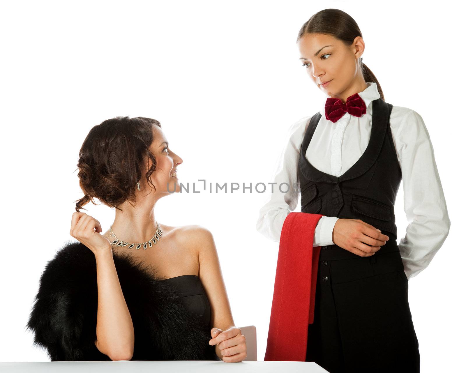 beautiful elegant woman making order to a waitress, isolated on white