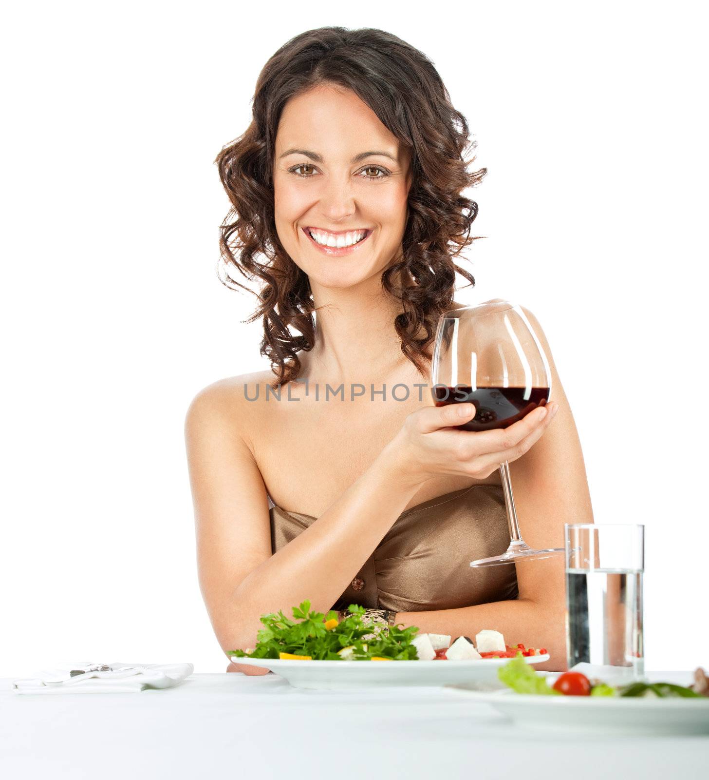 elegant female dining, holding glass of wine, isolated on white