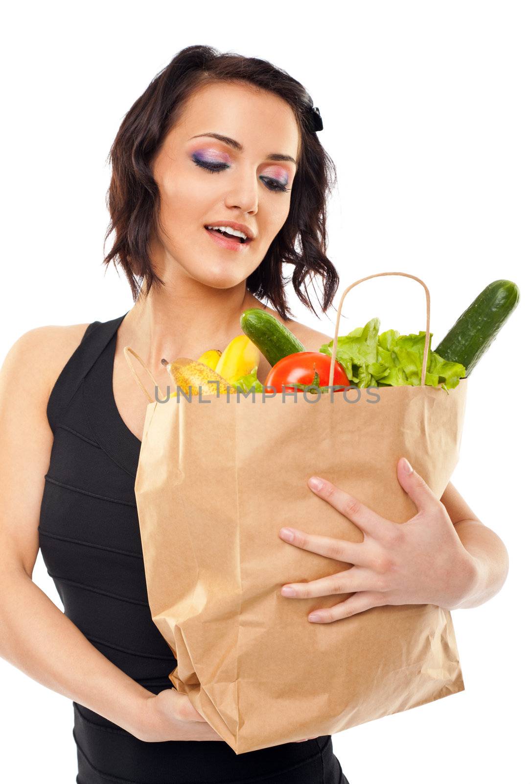 Woman holding grocery bag by vilevi