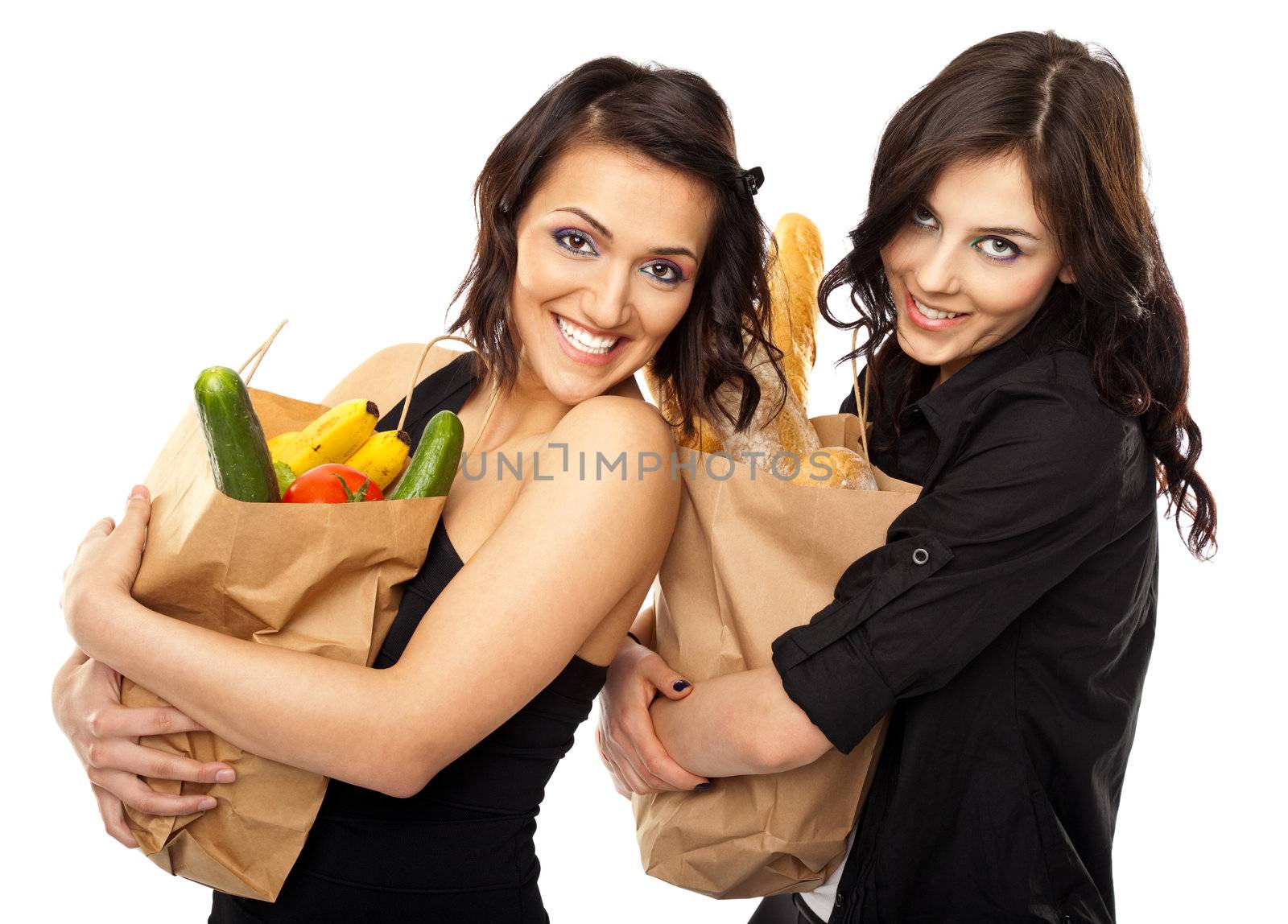 Two women holding groceries by vilevi