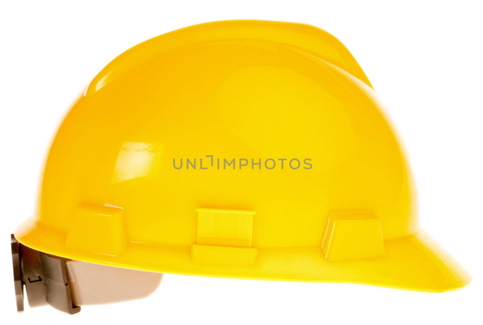 Close-up of new yellow hardhat isolated on white background