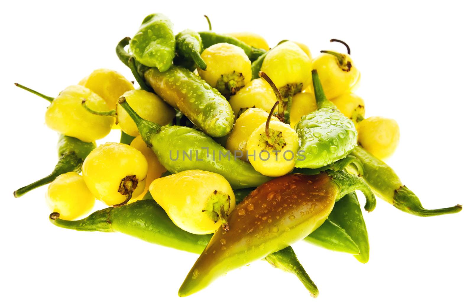 pile of green and yellow hot chili peppers