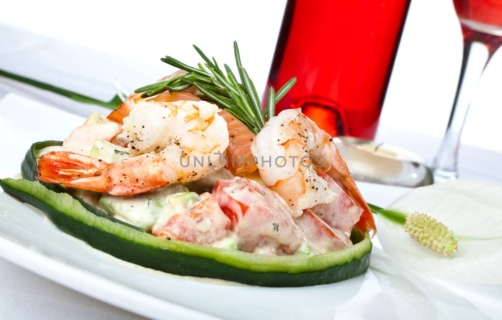 Close-up of shrimp and salmon seafood salad with whine