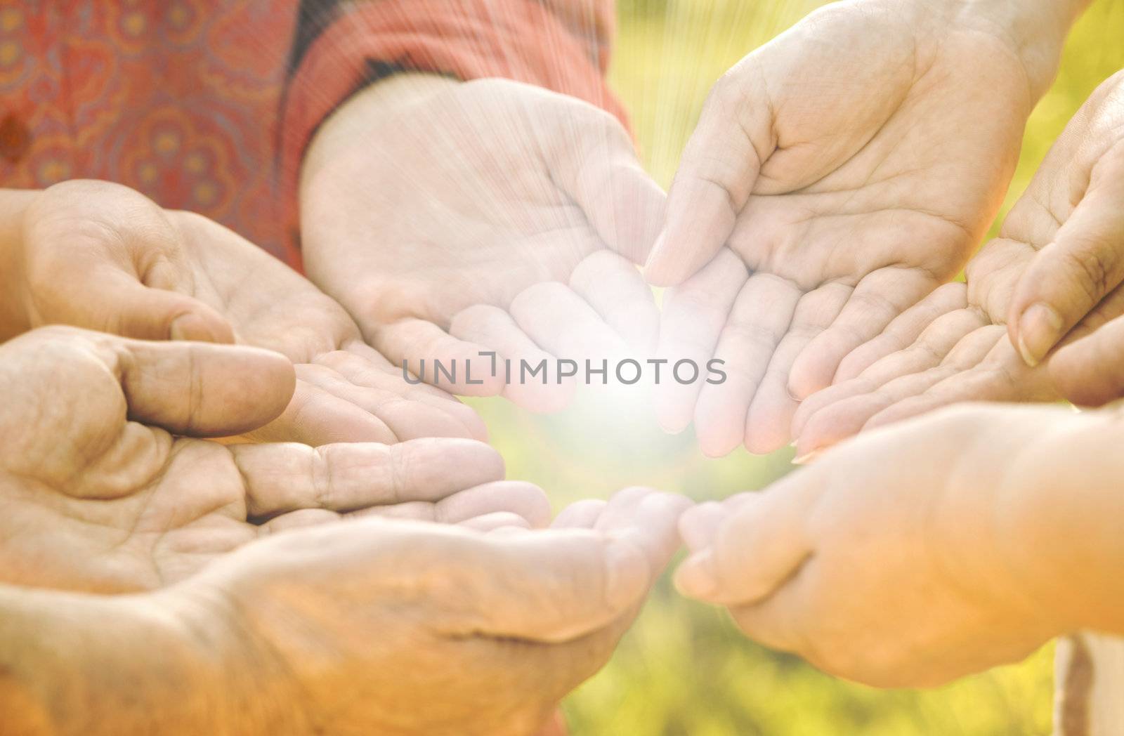 focus point on  center hands (red shirt) special toned and sun light photo f/x