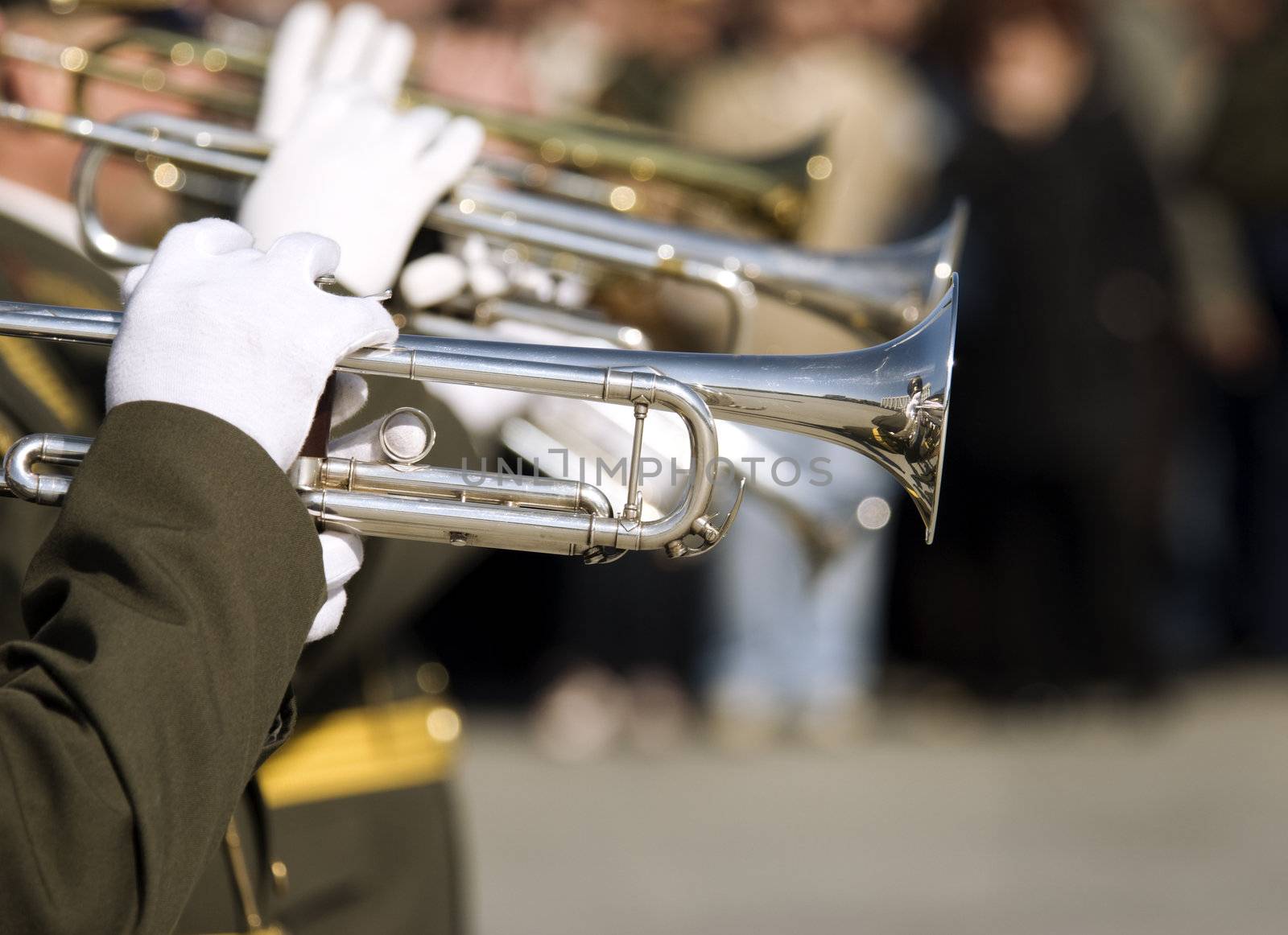 editorial photo,hands of musicians with trumpets (selective focus)