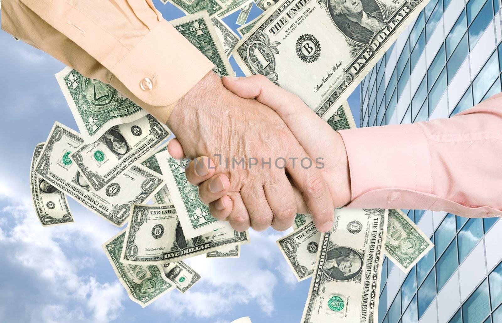 a lot of dollars(like a wind) outside office building and business handshake