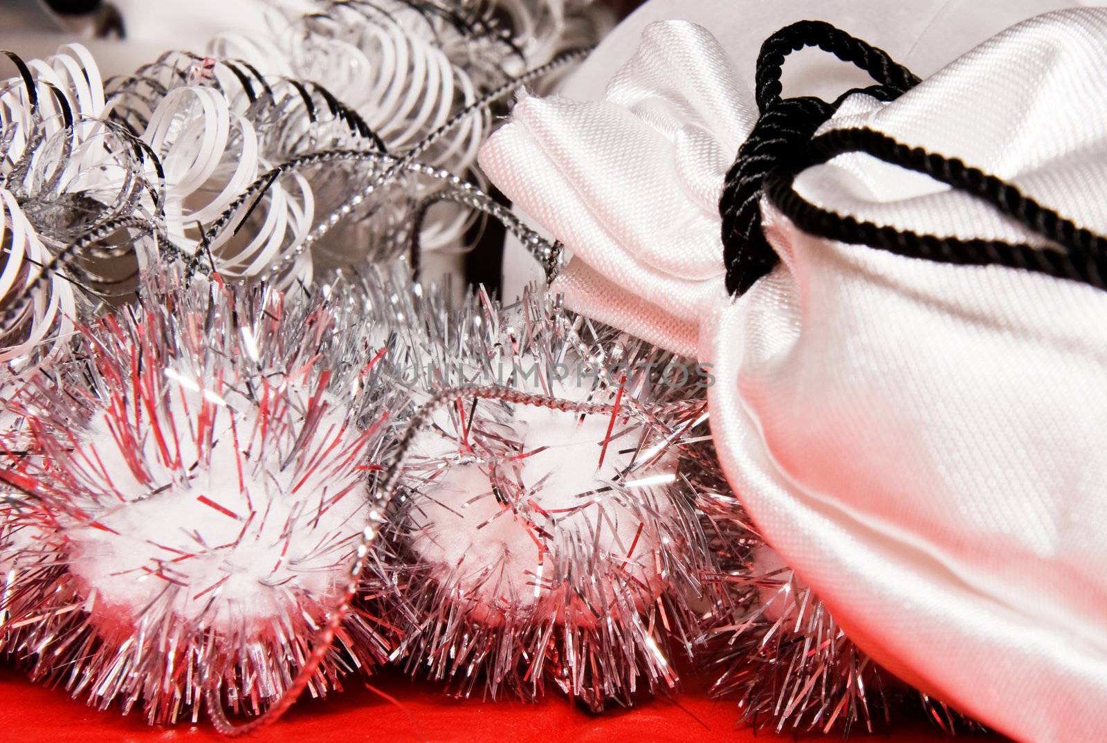 xmas decoration with gift bag on a red cloth 
