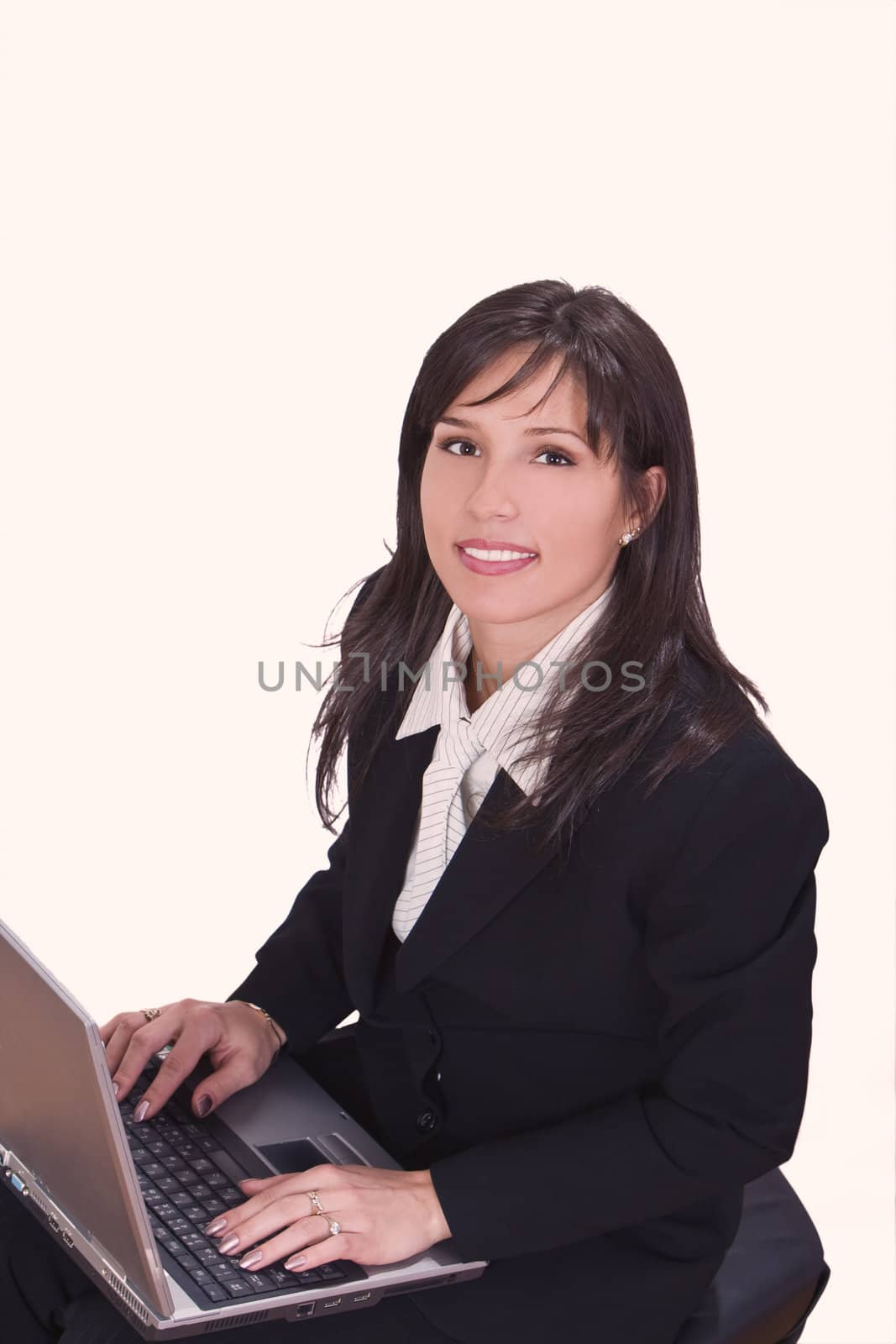 Smilling brunette working on a laptop by RazvanPhotography