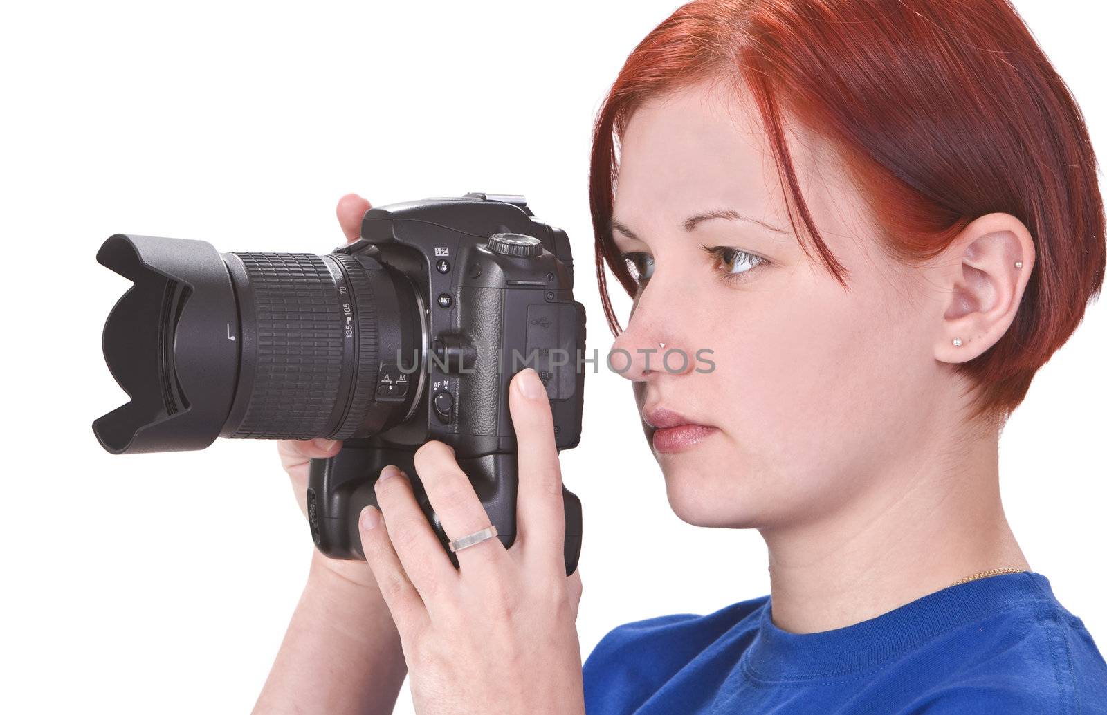 Profile of a redheaded girl taking photos with a DSRL camera.Shot with Canon 70-200mm f/2.8L IS USM