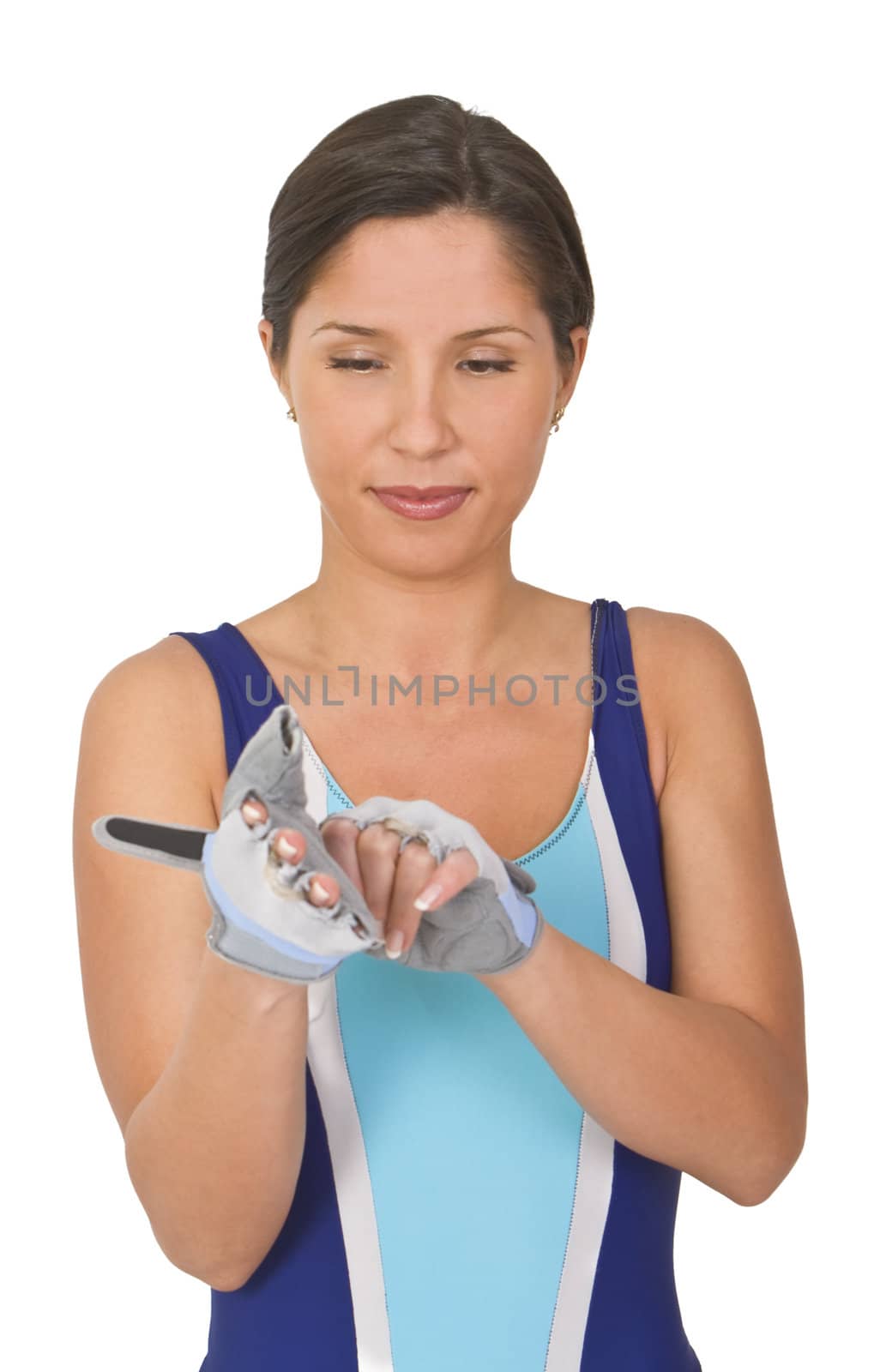 Woman putting on her mittens before starting her fitness programme. 