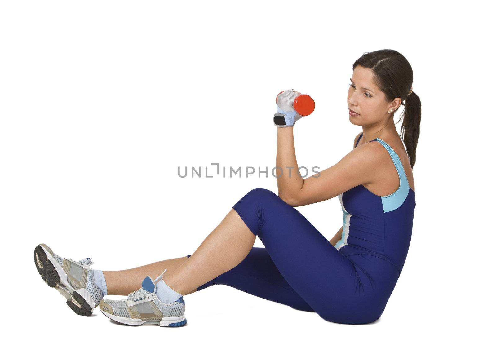 Young active woman doing a barbell exercise. 