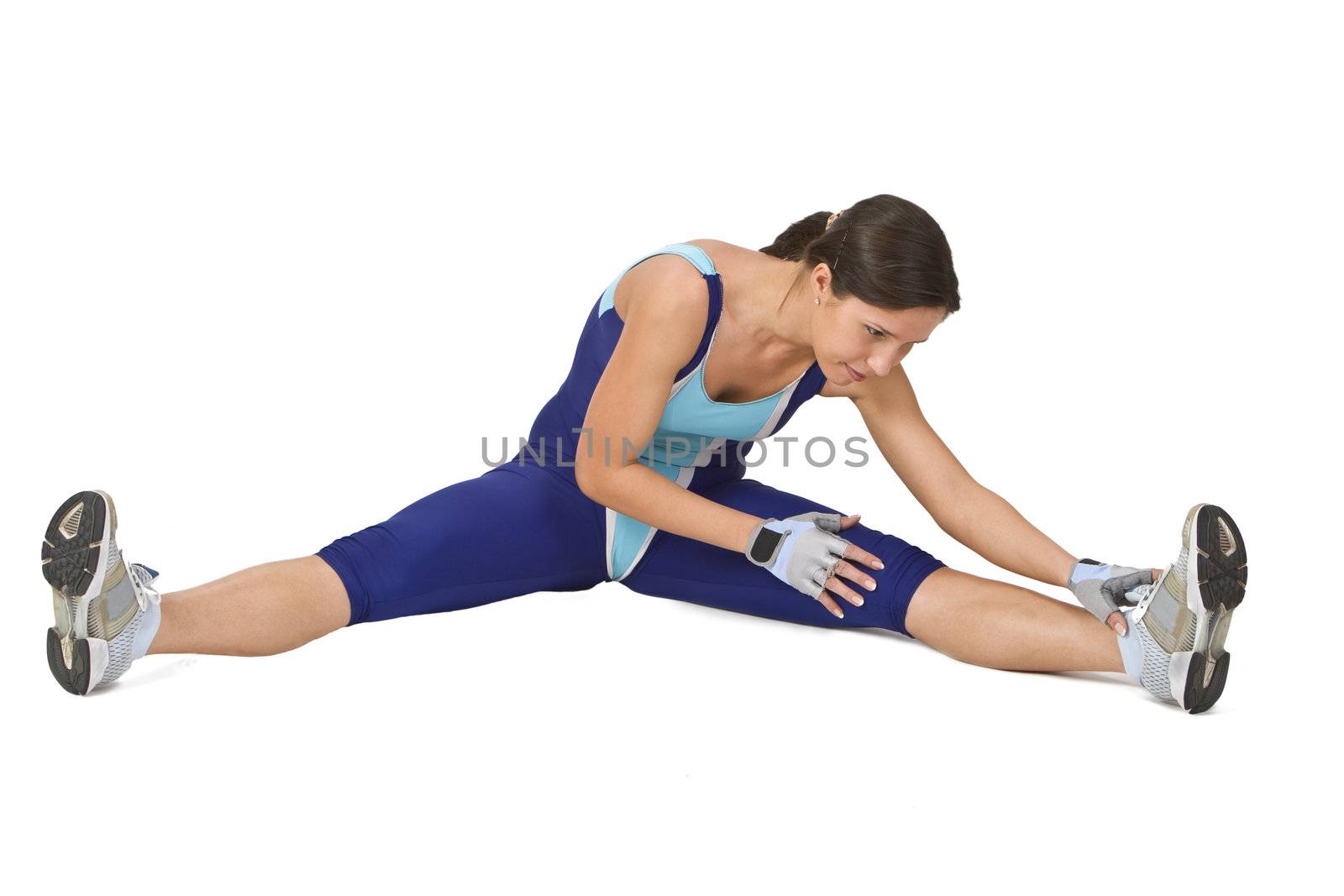 Active young woman doing warming up stretching movements.